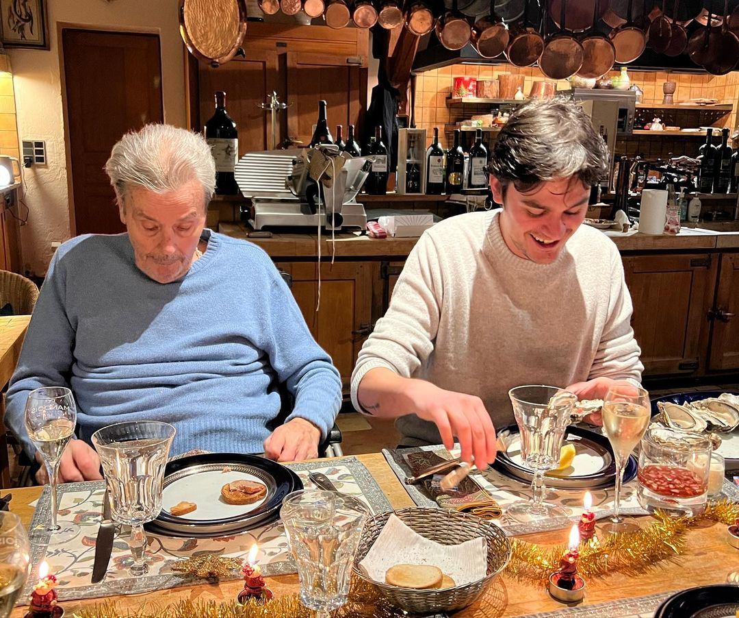 Alain and Alain-Fabien enjoying Christman dinner, from an Instagram post, dated December 25, 2023 | Source: Instagram/alainfabiendelon/?hl=en