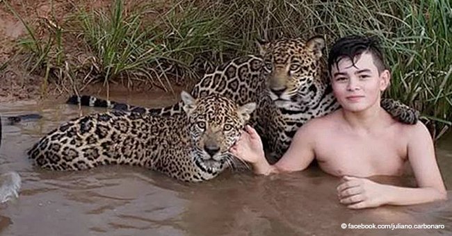 Here's the story behind the viral photo of a kid playing with two jaguars
