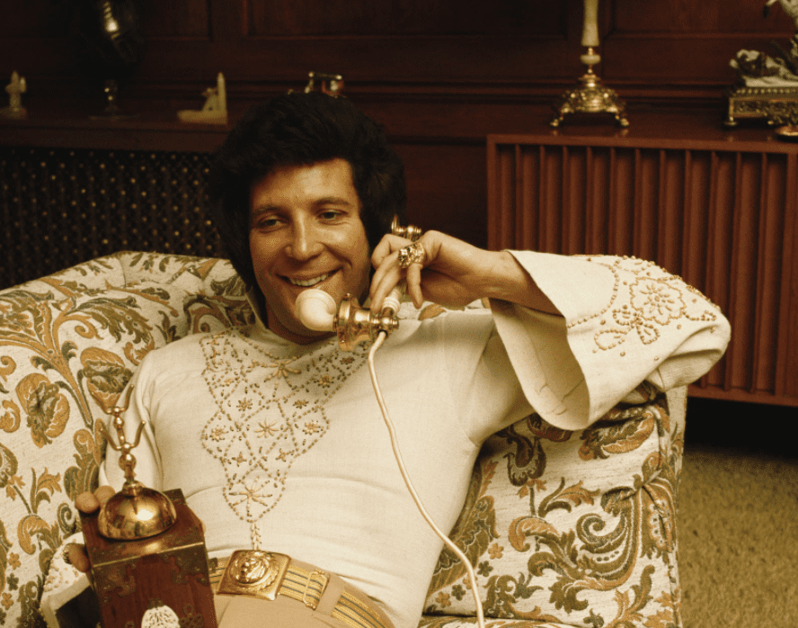 An undated image of Tom Jones on the telephone at his home in St Georges Hill, near Weybridge | Source: Getty Images