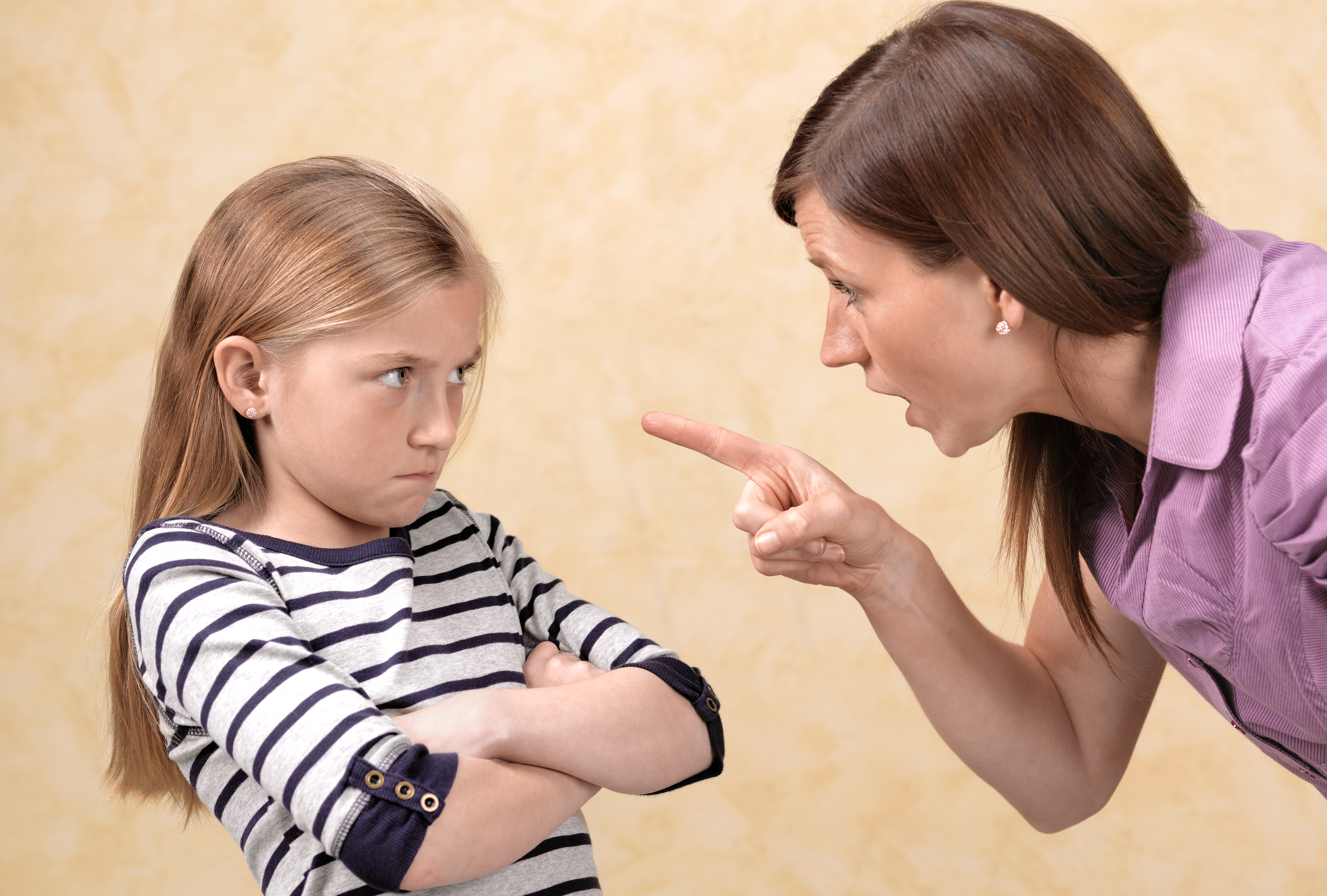 A woman yelling at a young girl | Source: Getty Images