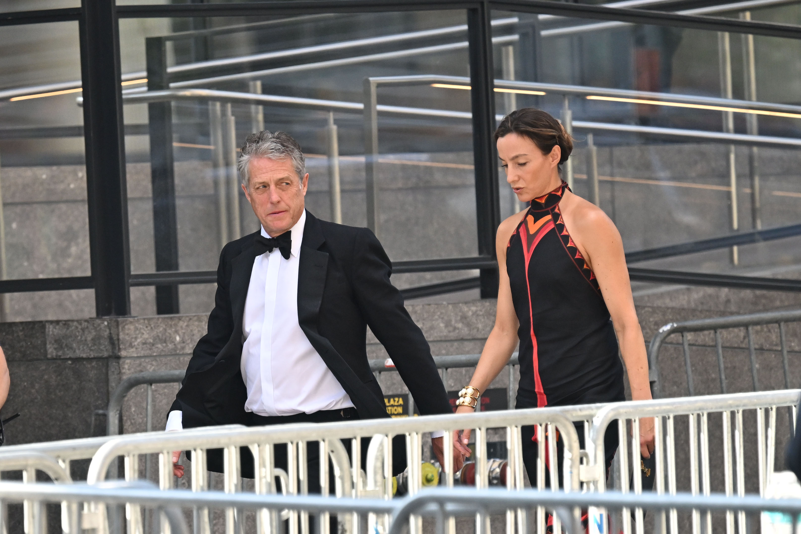 Hugh Grant and his wife, Anna Elisabet Eberstein, arrive at Madison Square Garden on July 3, 2026, for Taylor Swift and Travis Kelce's wedding. The actor was among the celebrity guests seen arriving at the venue. | Source: Getty Images
