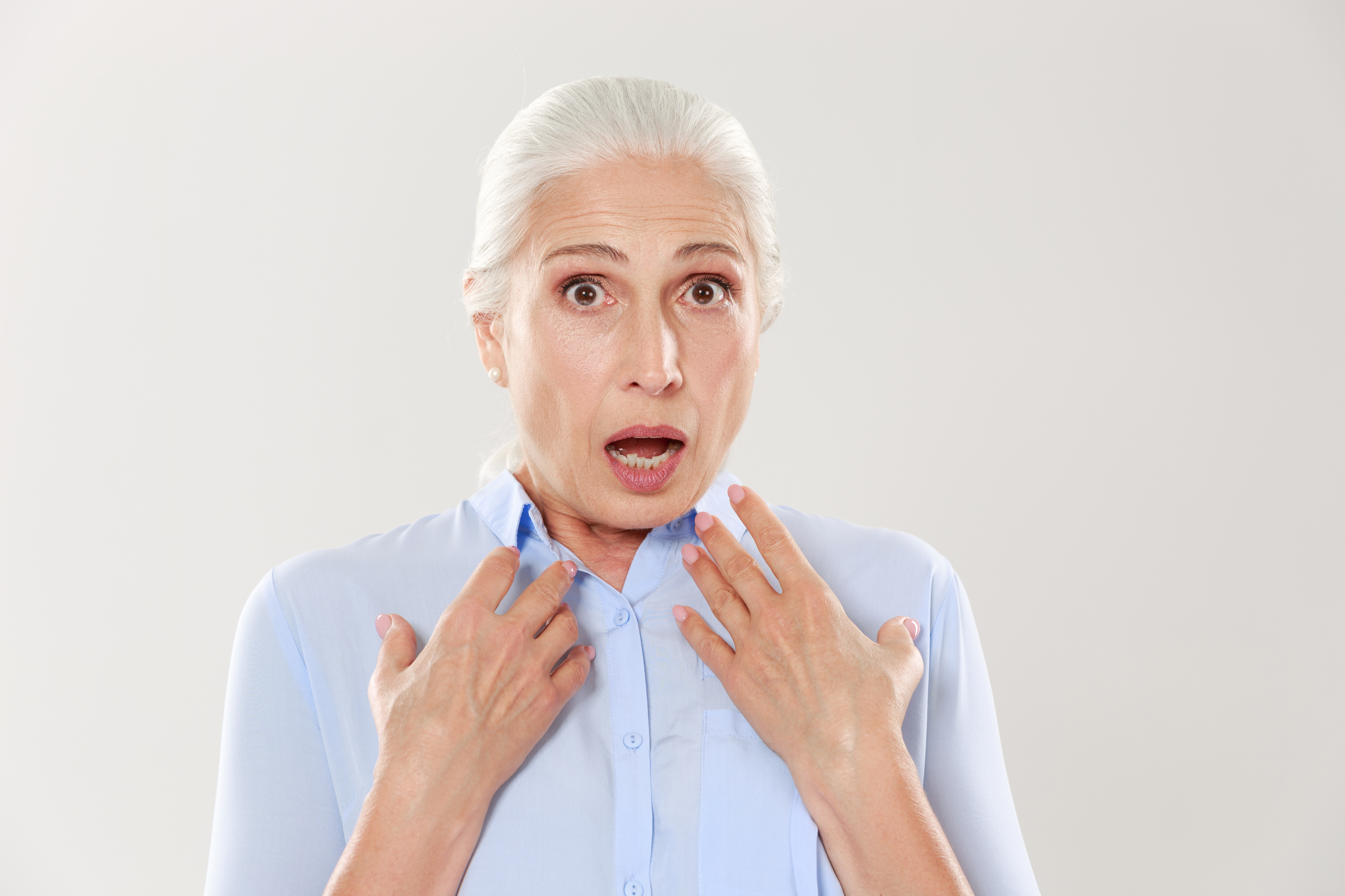 An older woman reacting in shock | Source: Shutterstock