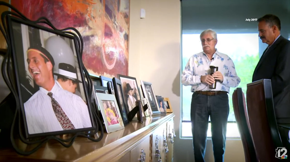 A screenshot of Fred Goldman showing family pictures, including a photo of Ron Goldman, in an interview with 12 News in 2017. | Source: YouTube/12NewsAZ