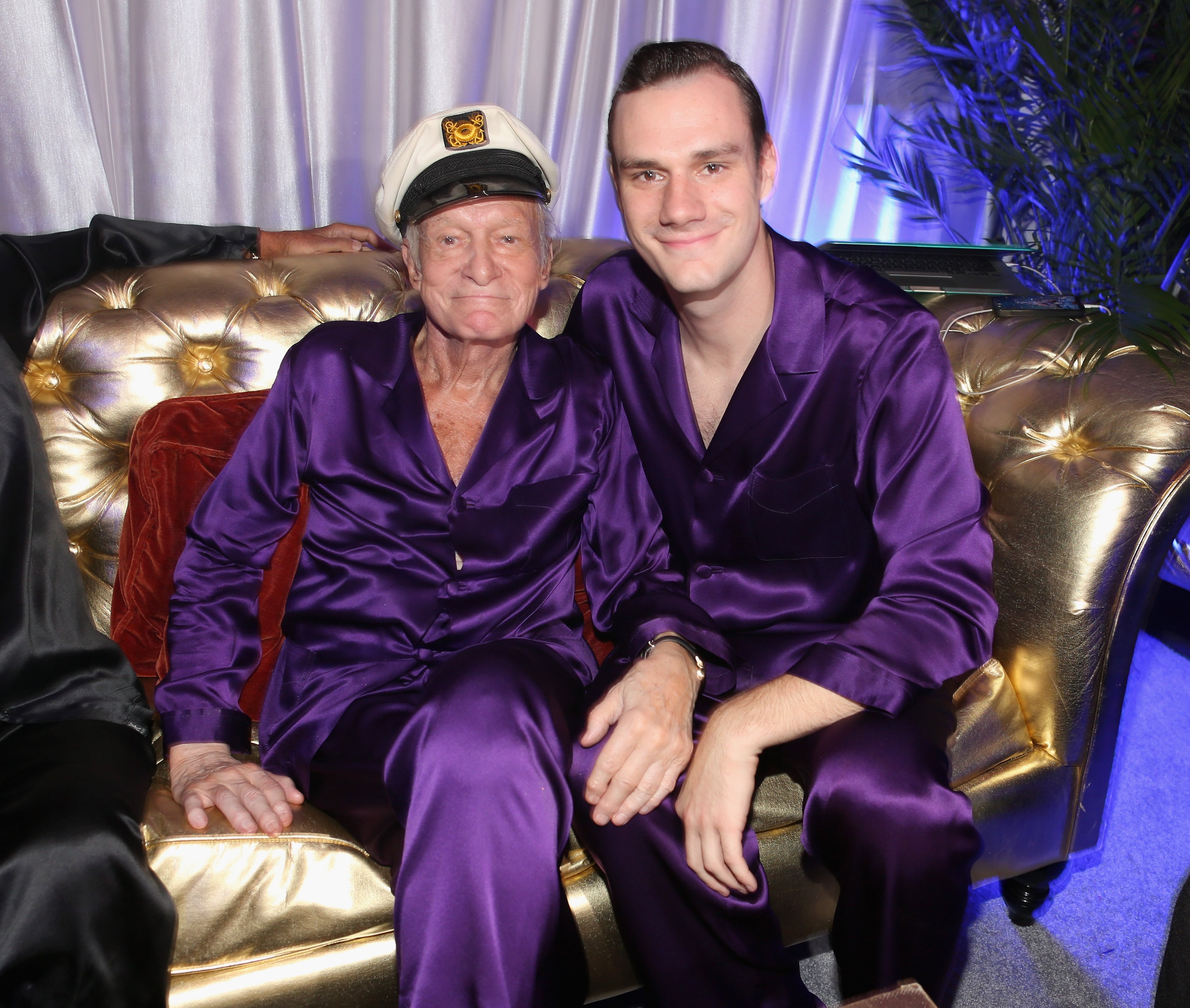 Hugh Hefner and his son Cooper Hefner attend the Annual Midsummer Night's Dream Party at the Playboy Mansion on August 16, 2014, in Holmby Hills, California. | Source: Getty Images