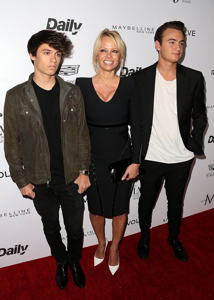 Pamela Anderson and her sons Brandon Thomas Lee (R) and Dylan Jagger Lee at the "Fashion Los Angeles Awards" on March 20, 2016, in West Hollywood, California | Photo: Frederick M. Brown/Getty Images