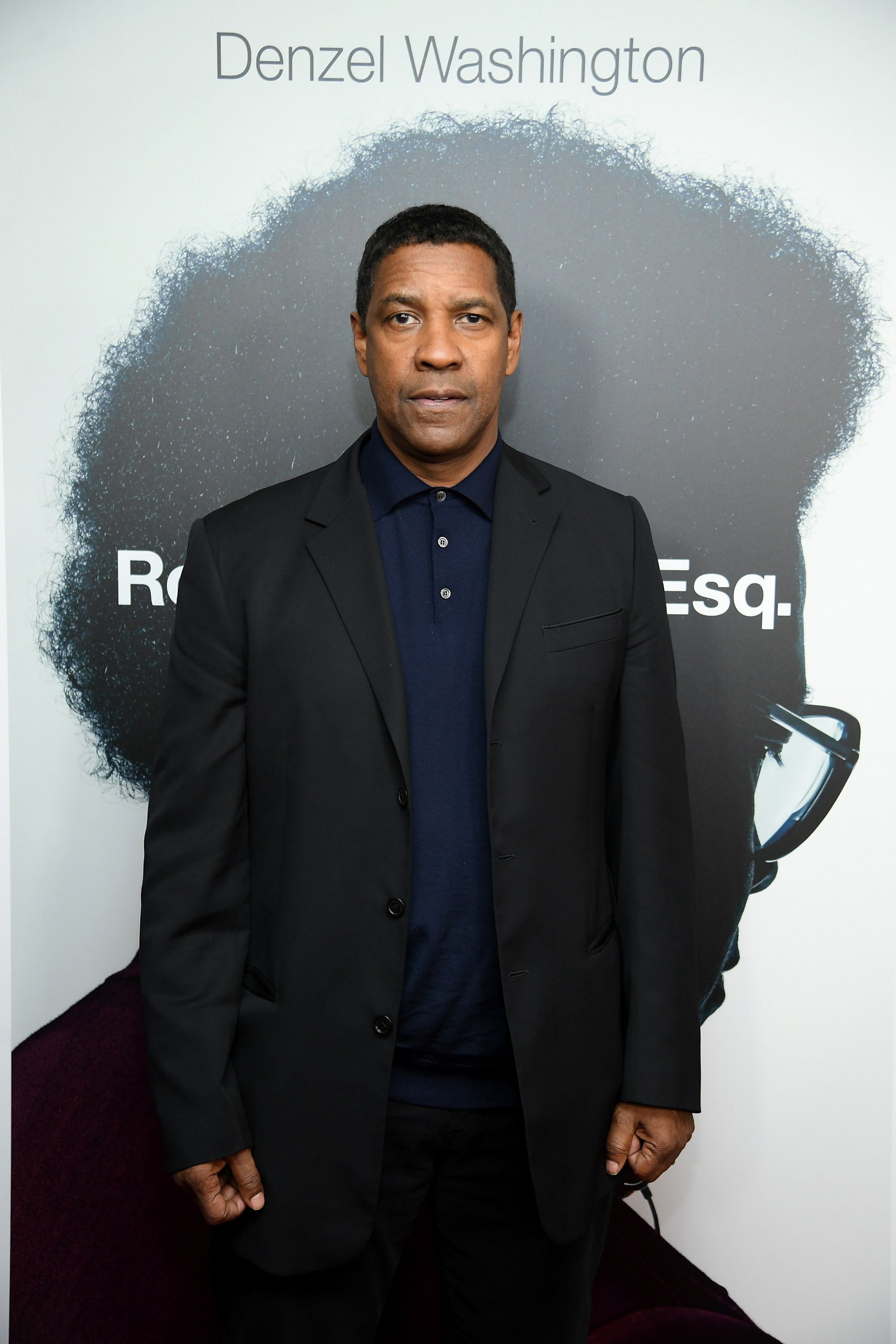 At a screening of "Roman J. Israel, Esq.," Denzel Washington rocks a short, texturized cut. His hair pairs well with a navy polo and black blazer — an understated style for the legal drama's press.