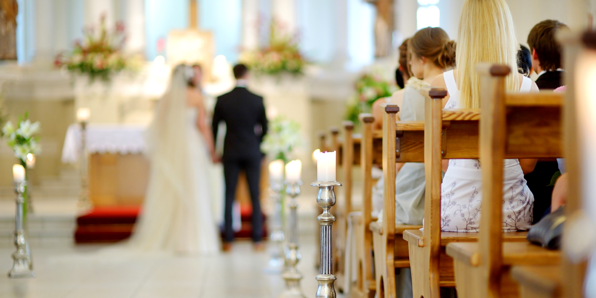 A bride and groom at the altar | Source: Shutterstock