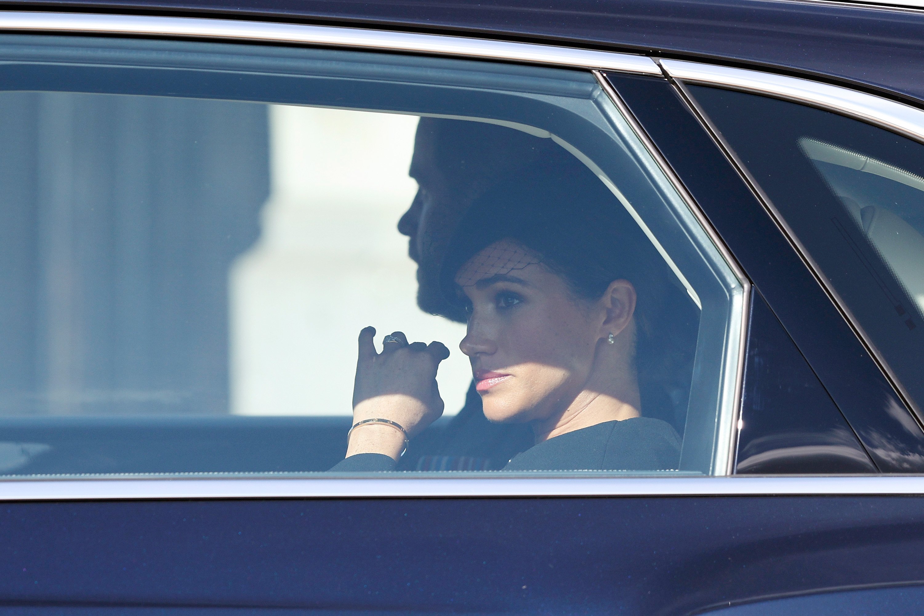 Prince Harry, Duke of Sussex and Meghan, Duchess of Sussex return by car to Buckingham Palace after attending a service for the reception of Queen Elizabeth II's coffin on September 14, 2022 in London, England | Source: Getty Images