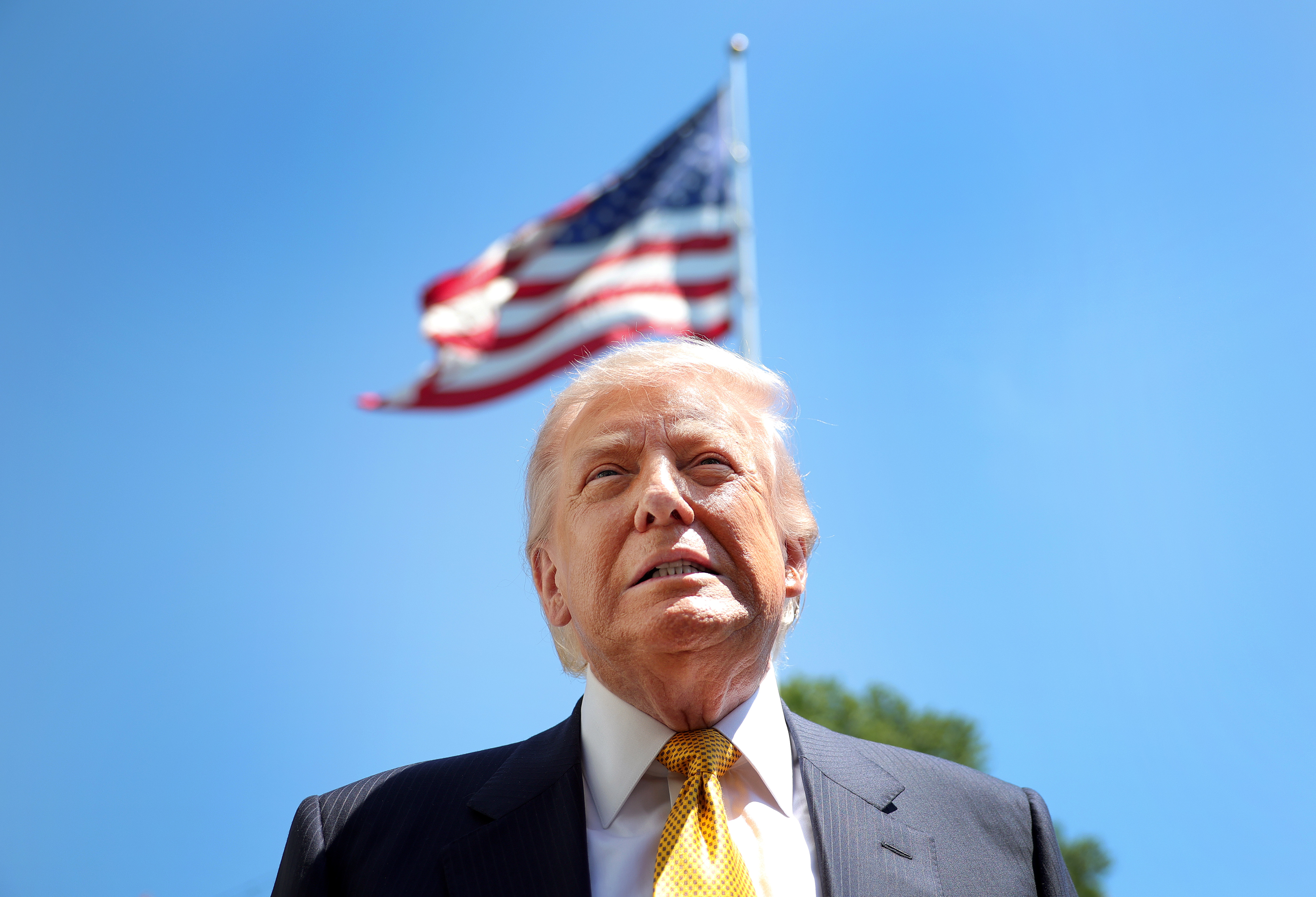 President Donald Trump speaks to reporters before departing the White House for China on May 12, 2026 | Source: Getty Images