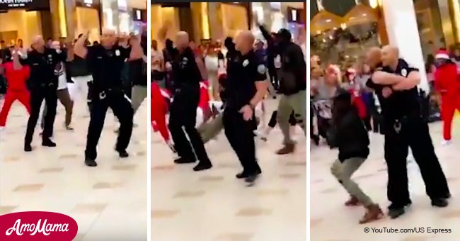 Two cops steal the spotlight in a Christmas flash mob