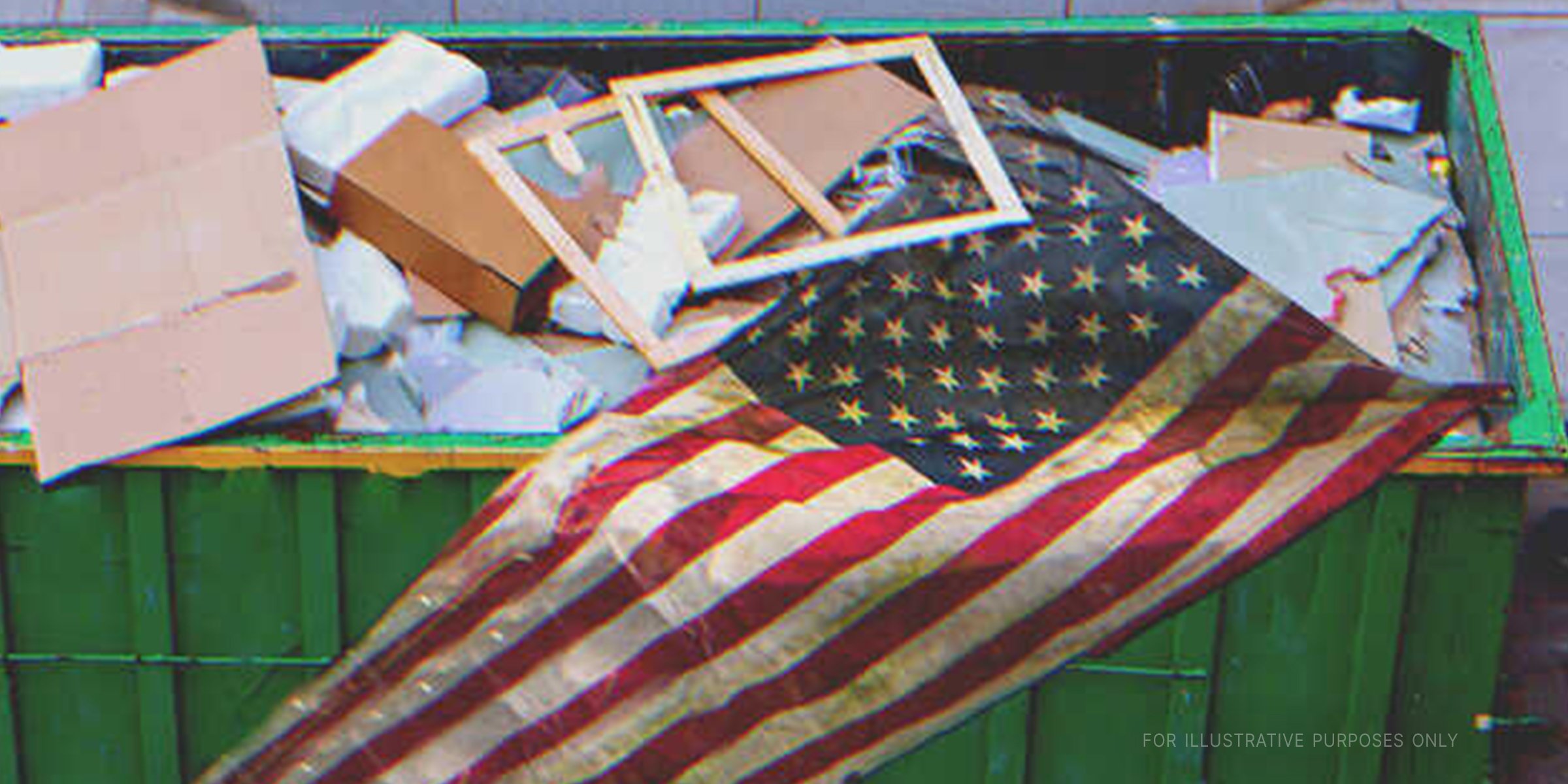 A flag in a dumpster | Source: Shutterstock