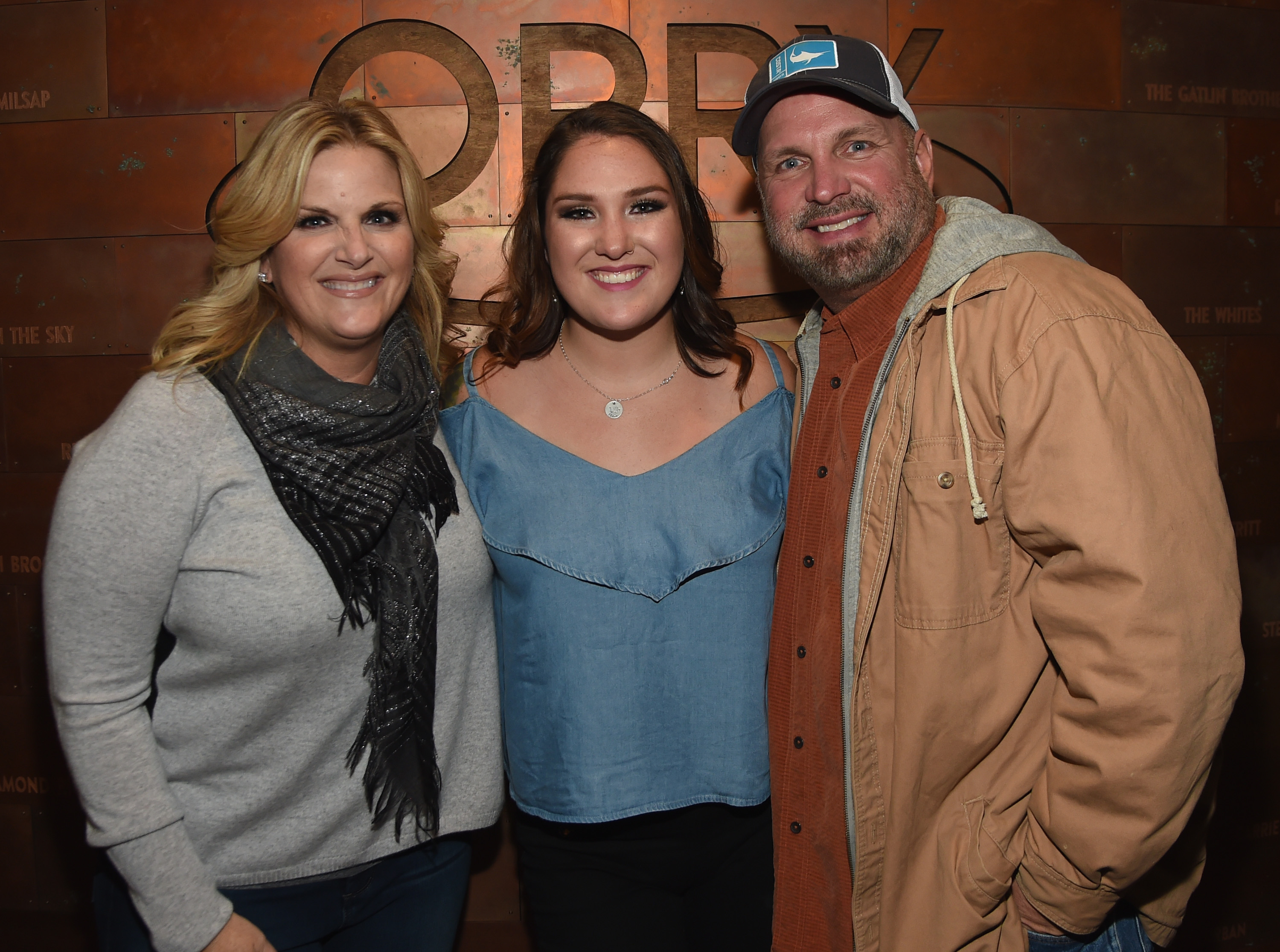 Trisha Yearwood, Allie Colleen Brooks, and Garth Brooks after Allie made her Grand Ole Opry debut during Dr. Ralph Stanley Forever: A Special Tribute Concert in Nashville, Tennessee, on October 19, 2017. | Source: Getty Images