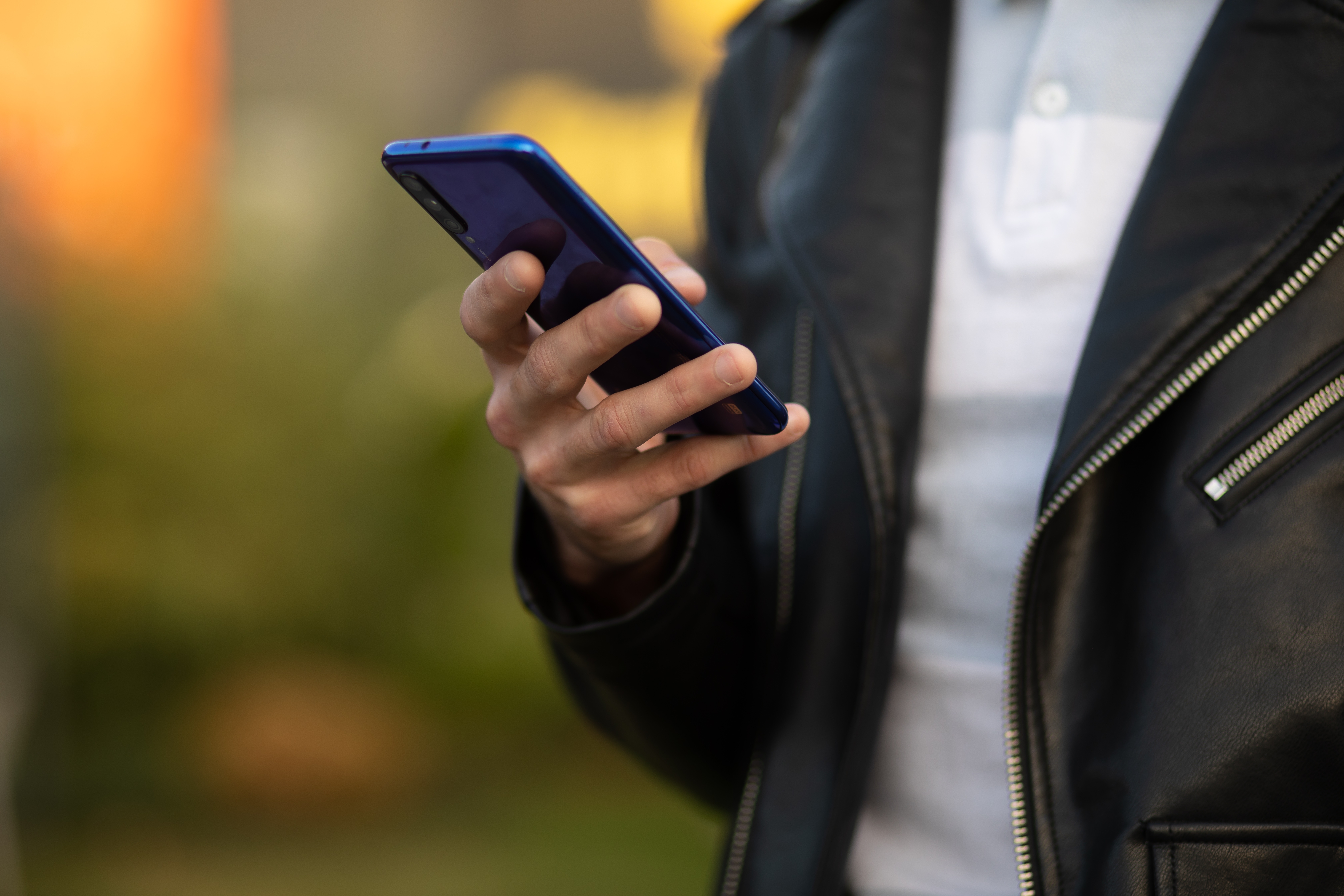 Close-up of a person holding a phone | Source: Shutterstock