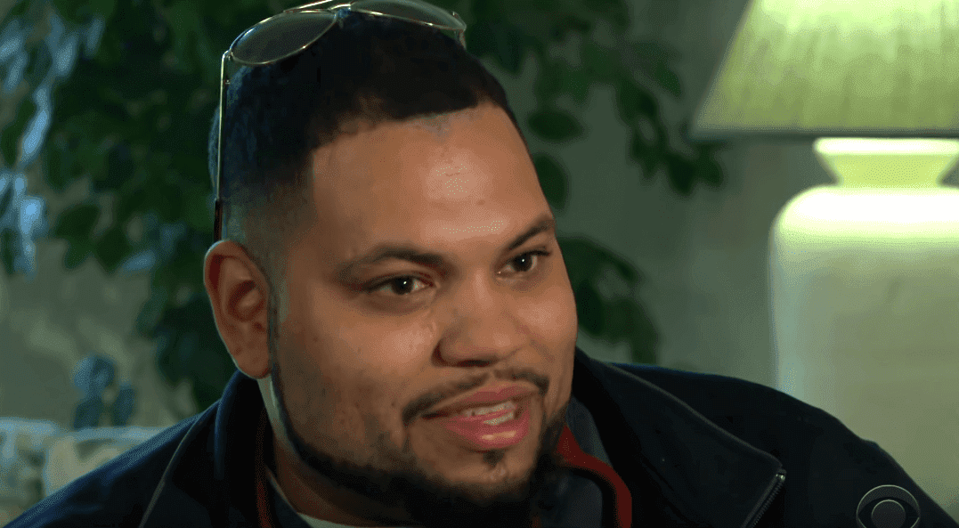 Lamont Thomas' first adopted child, Michael Perez, during an interview. | Photo: YouTube/CBS Evening News