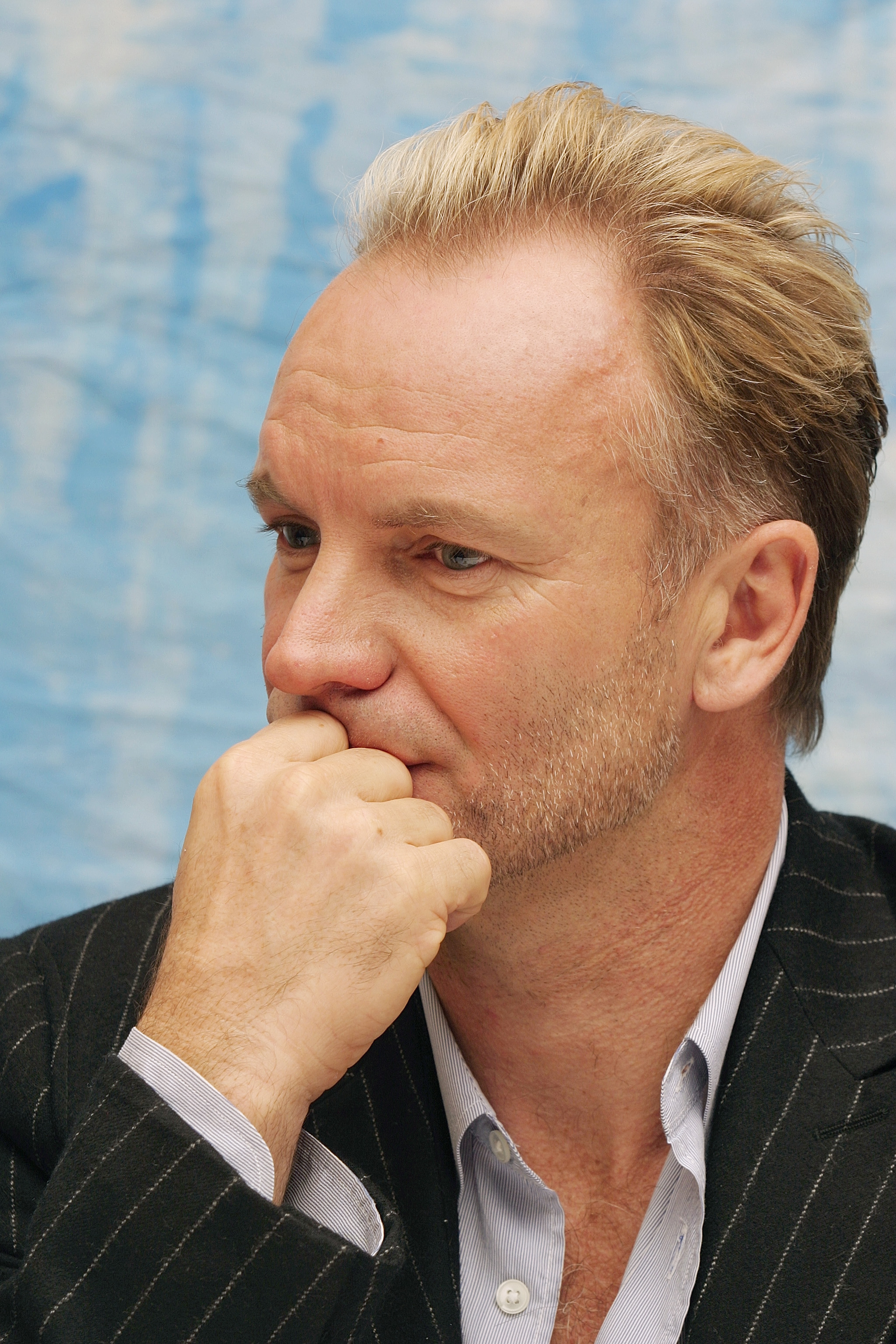 Sting answers questions from the press at a junket for his new film "Cold Mountain" in Los Angeles, California on December 8, 2003. | Source: Getty Images