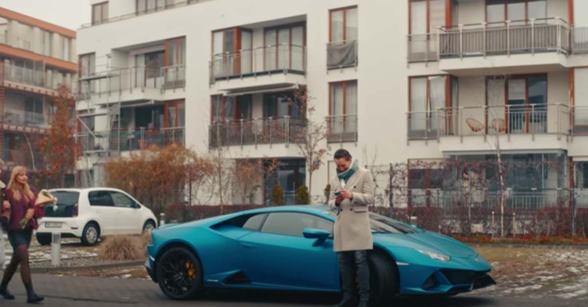 Man standing next to a luxury car | Source: Youtube/DramatizeMe