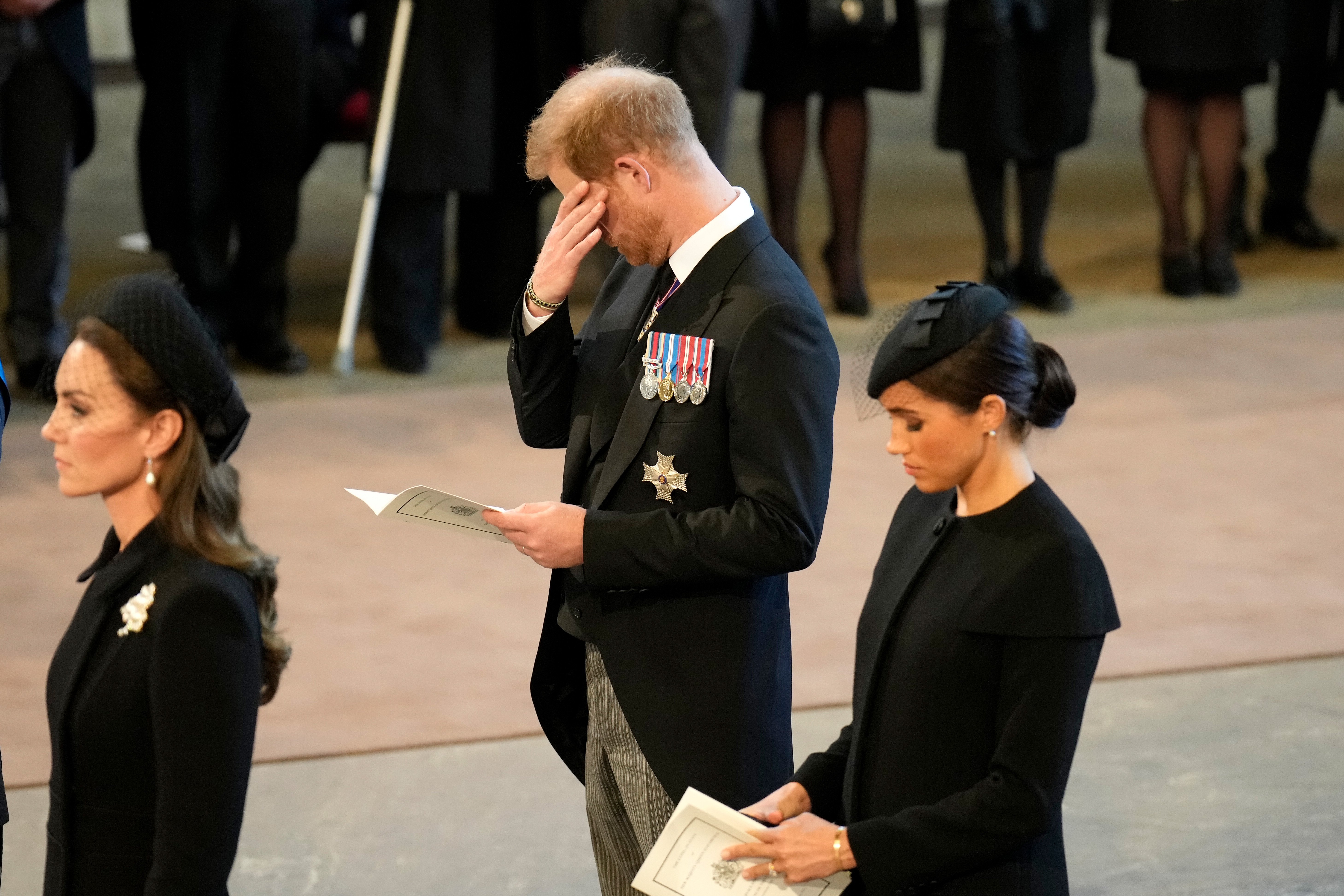 Catherine, Princess of Wales, Prince Harry, Duke of Sussex, and Meghan, Duchess of Sussex pay their respects in The Palace of Westminster after the procession for the Lying-in State of Queen Elizabeth II on September 14, 2022, in London, England. | Source: Getty Images