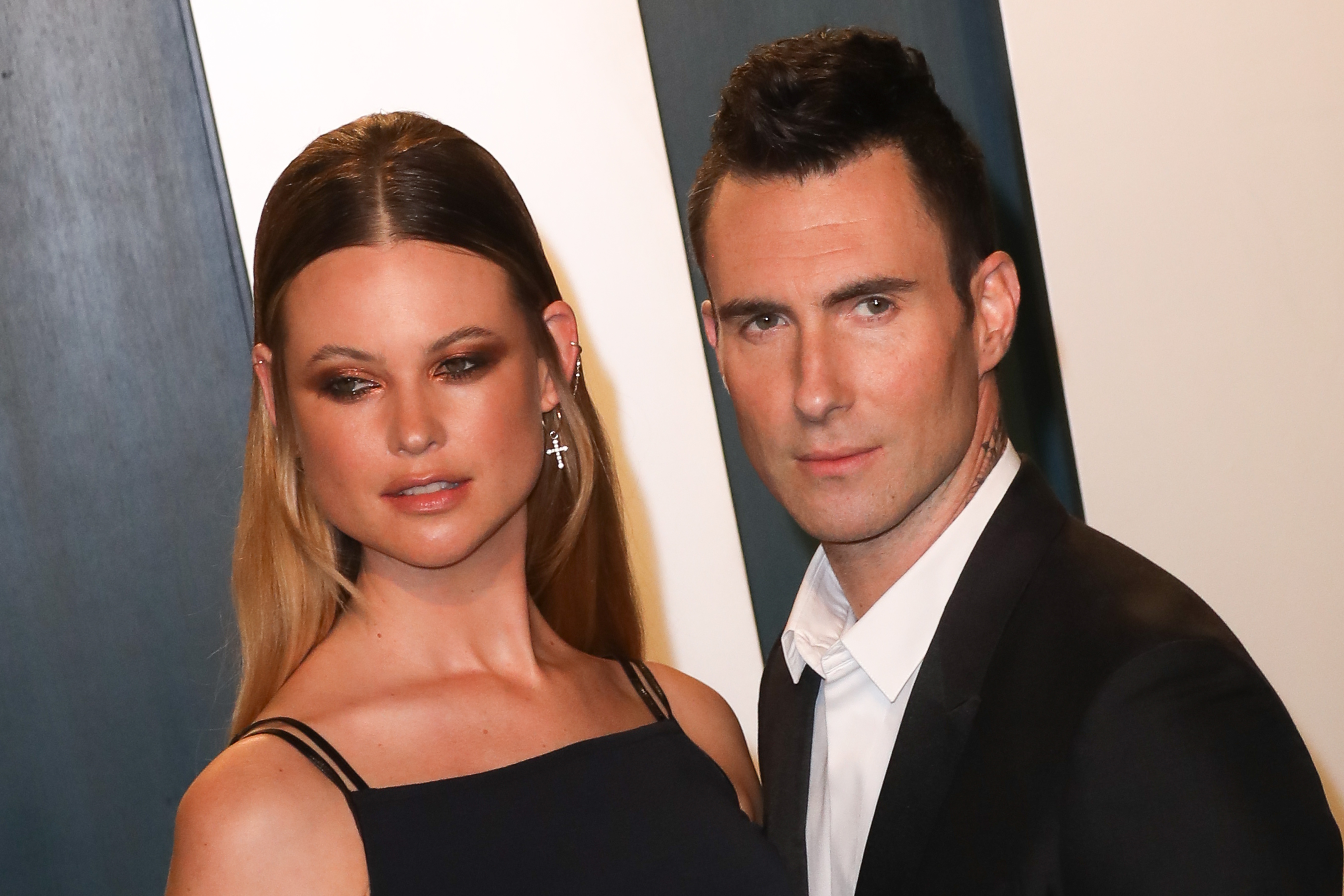 Behati Prinsloo and Adam Levine attend the Vanity Fair Oscar Party at Wallis Annenberg Center for the Performing Arts on February 9, 2020, in Beverly Hills, California.