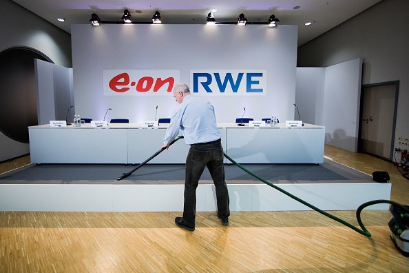 A man using a vacuum cleaner | Photo: Getty Images