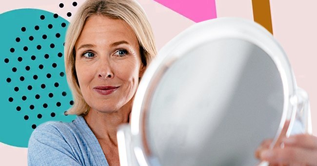 Une femme regarde le miroir. | Photo : Getty Images