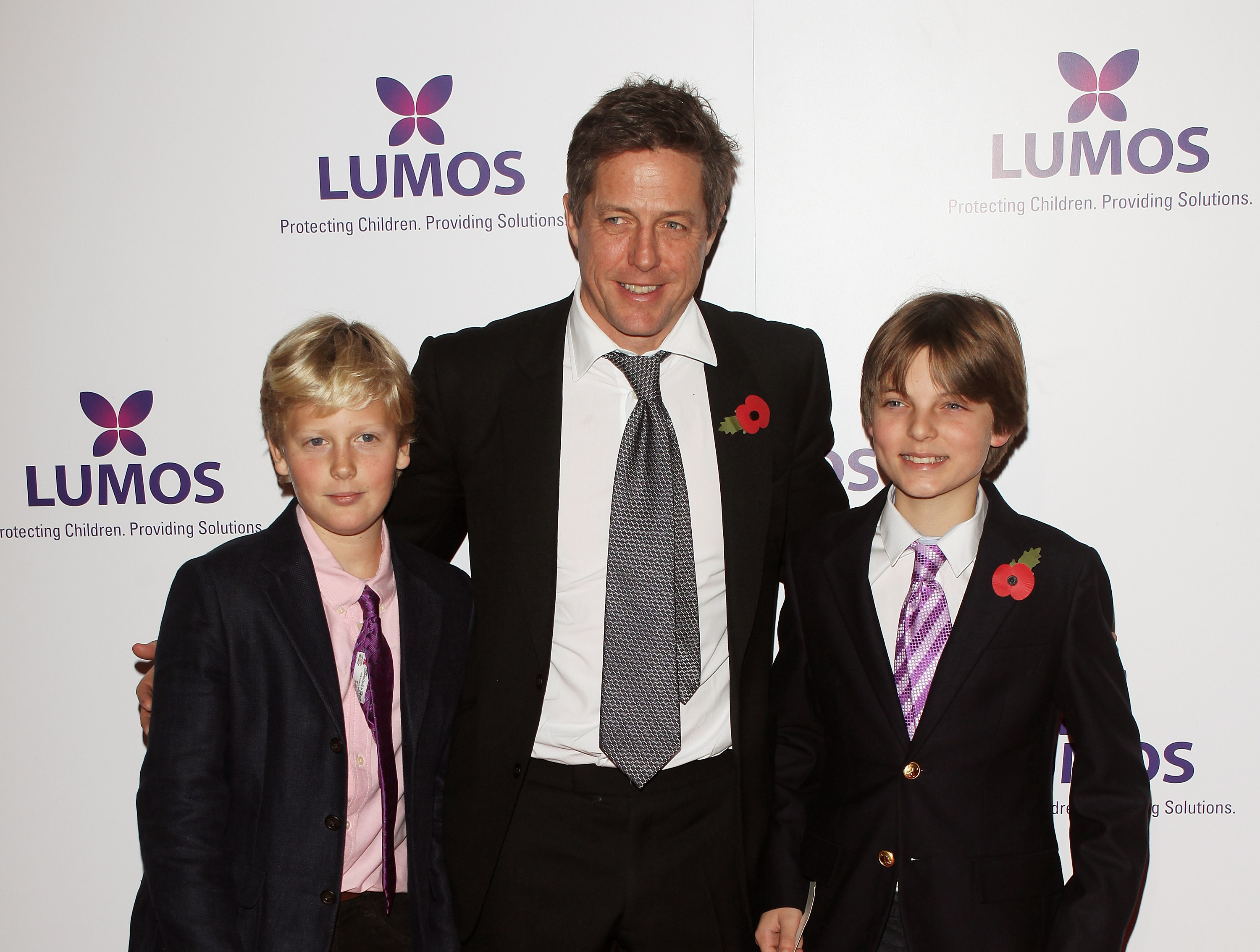 Hugh Grant and Damian Hurley during the Lumos fundraising event on November 9, 2013, in London, England. | Source: Getty Images