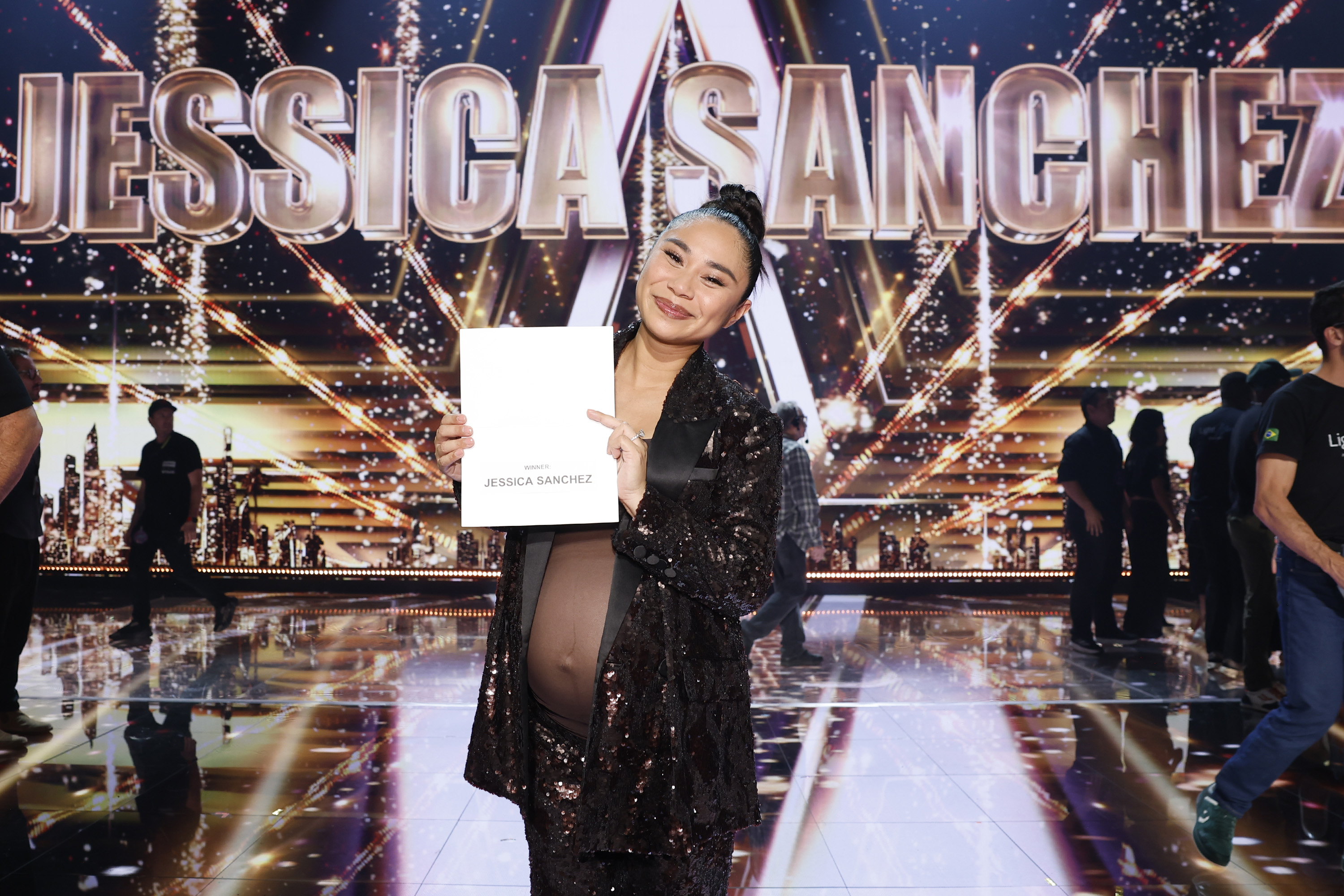 Jessica Sanchez poses with her winner's certificate after being crowned Season 20 champion of "America's Got Talent" in Los Angeles on September 24, 2025 | Source: Getty Images