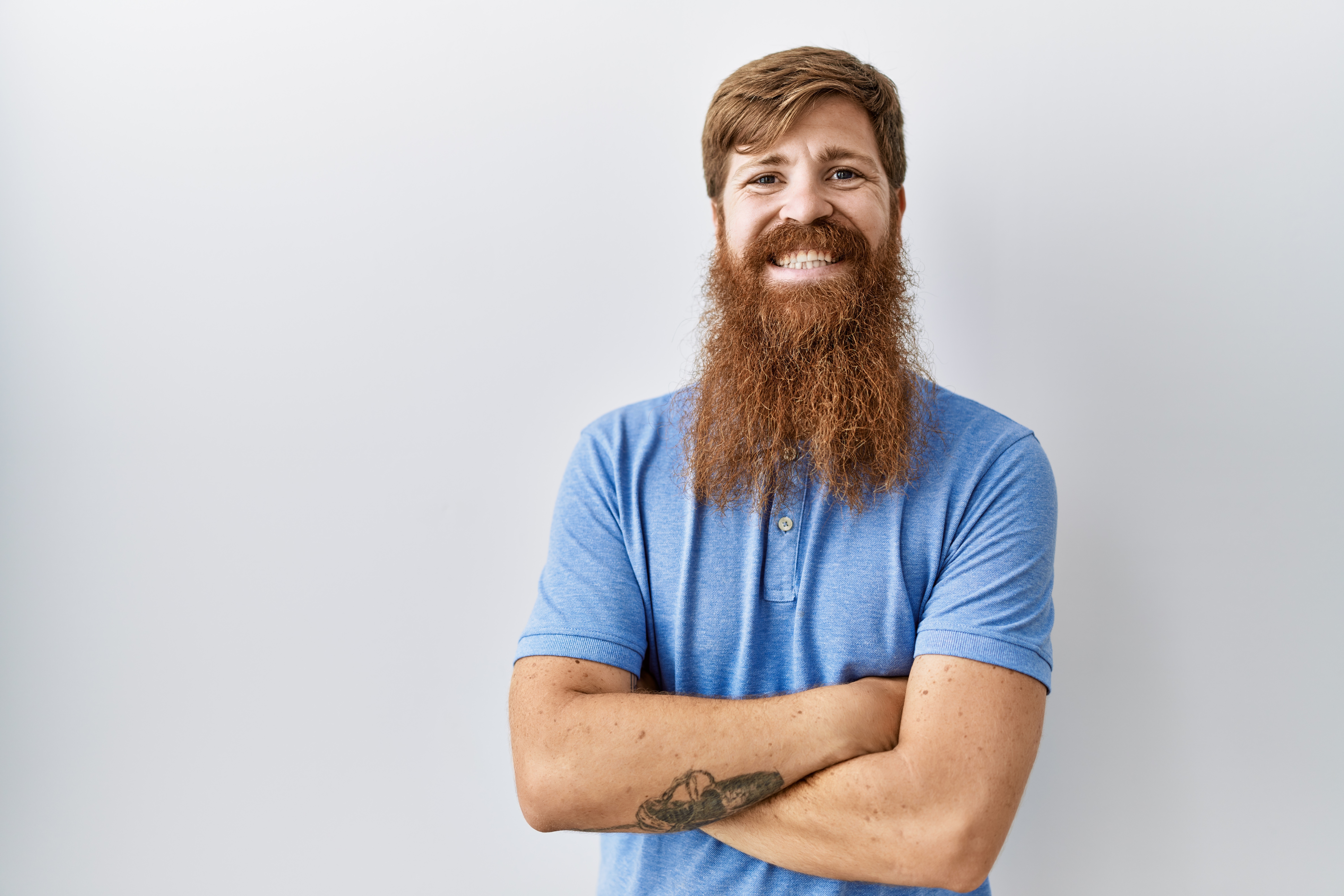 A mean with a long beard smiling | Source: Shutterstock