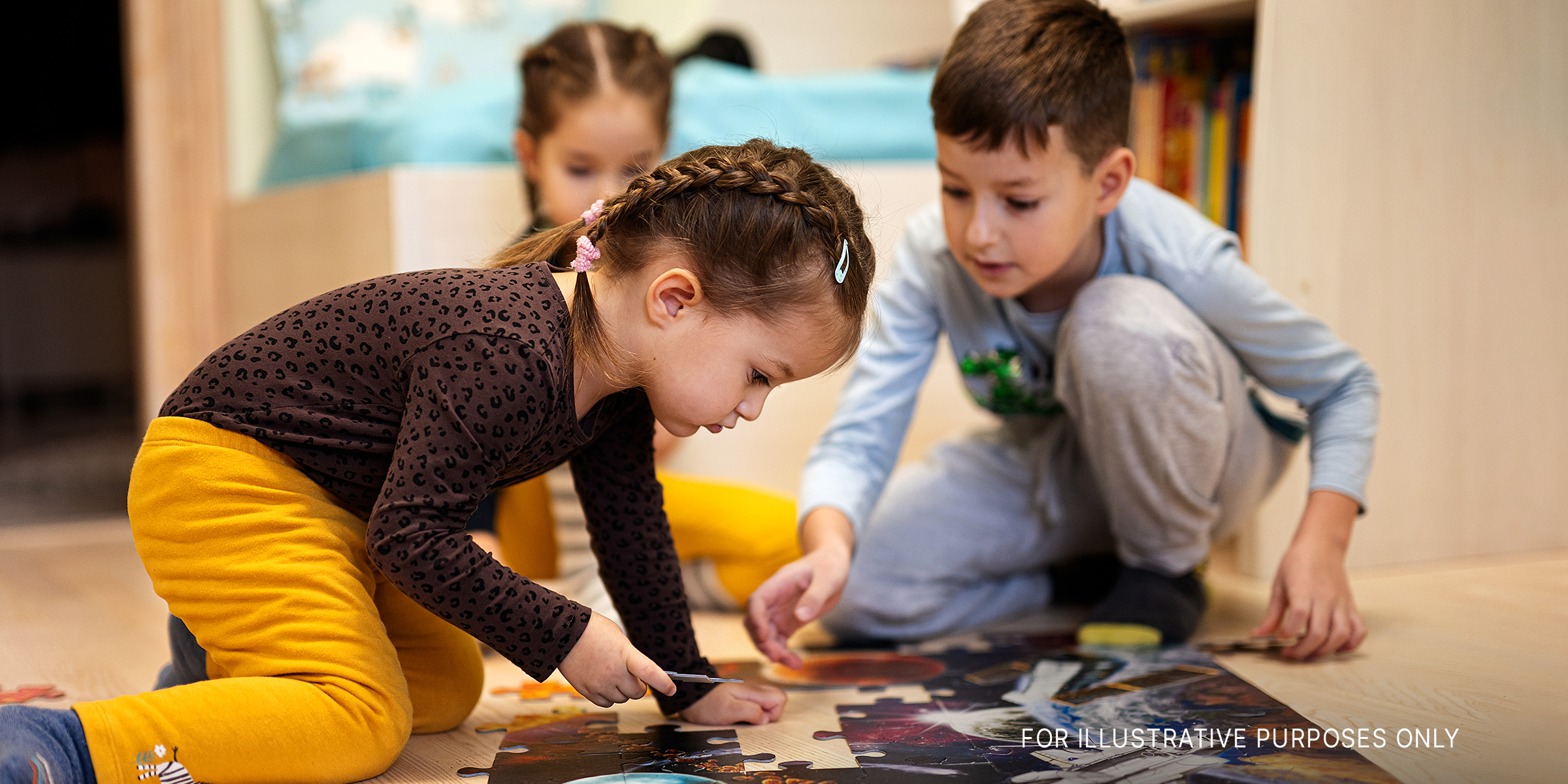 Children doing a puzzle | Source: Shutterstock