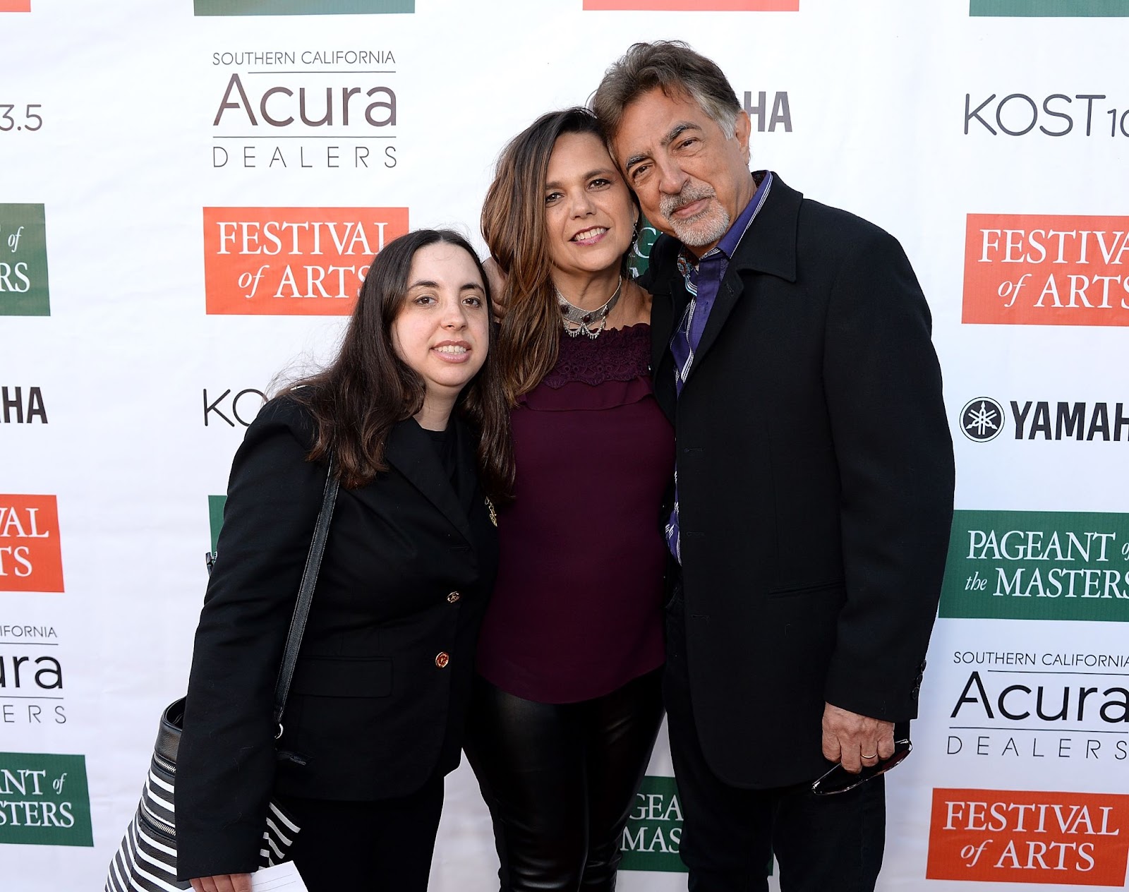 Mia and Joe Mantegna with the Festival of Arts/Pageant of the Masters PR Director Sharbie Higuchi at The Festival of Arts Celebrity Benefit Event on August 26, 2017, in Laguna Beach, California. | Source: Getty Images