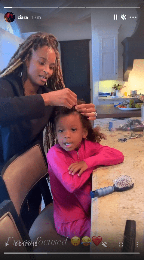 Ciara braiding her daughter Sienna's hair | Photo: Instagram/ciara
