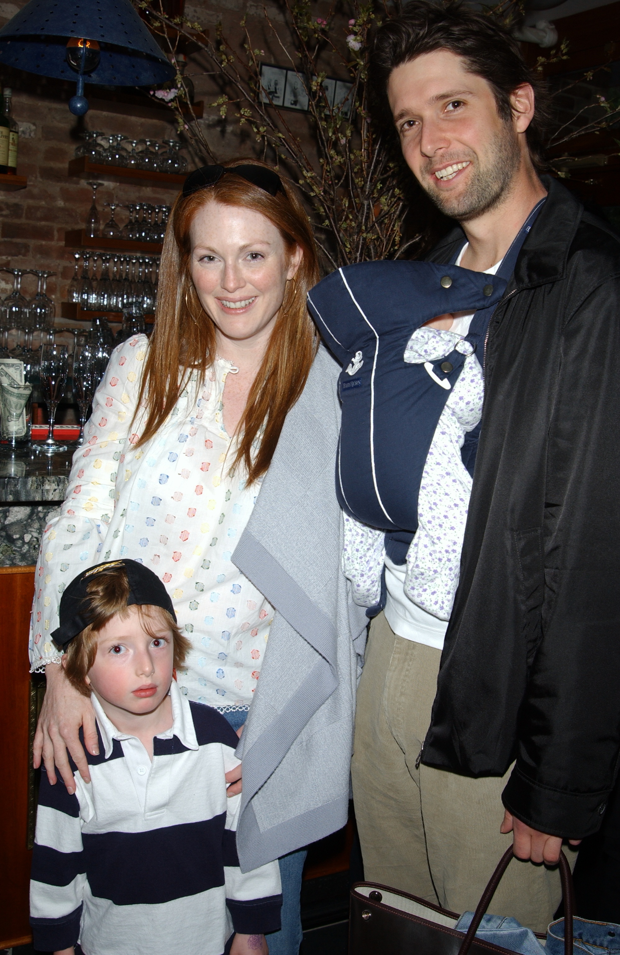 Julianne Moore, Bart Freundlich, their son, Caleb, 4, and daughter Liv, 6-weeks-old at a book party at Da Silvano Cantinetta in the Village on May 22, 2002 | Source: Getty Images