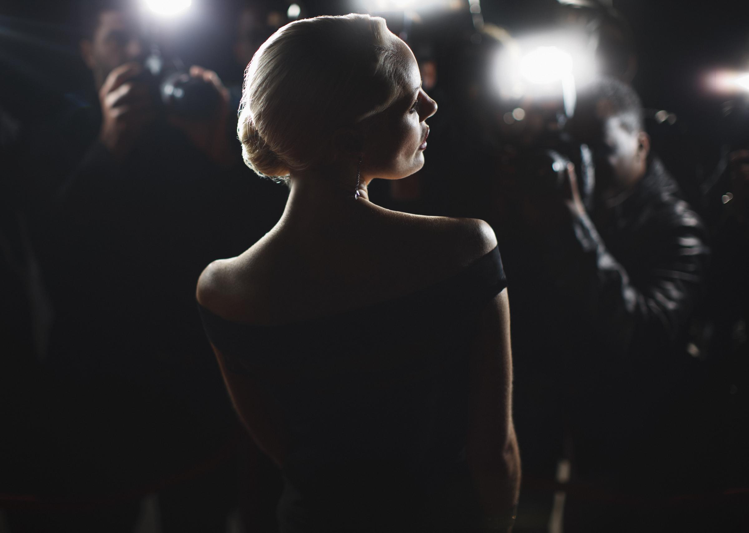 A celebrity posing for the paparazzi | Source: Getty Images