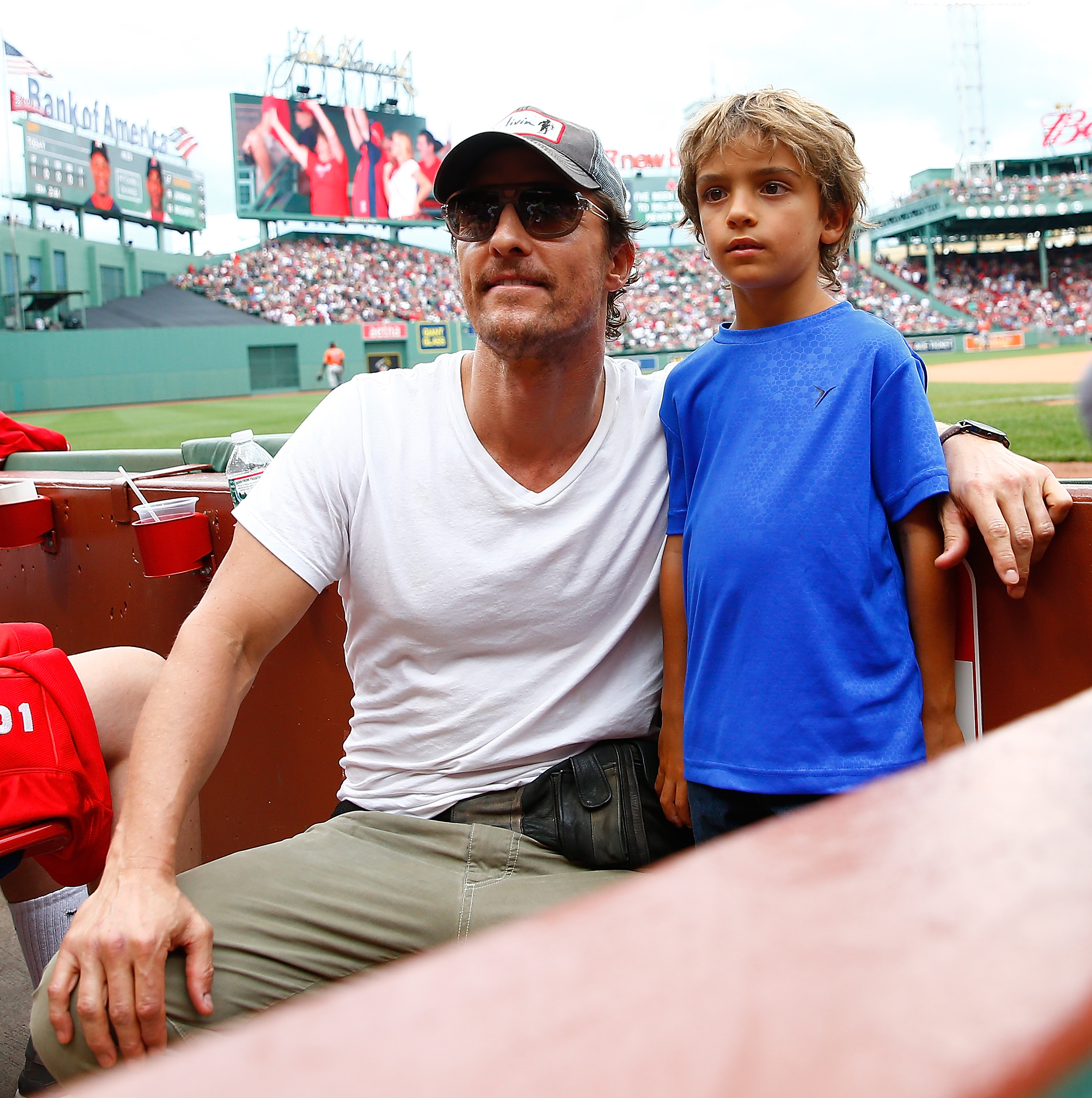 Game day with dad — Sporting a bright blue tee, Levi cheers on the Red Sox at Fenway Park with his father on August 17, 2014.