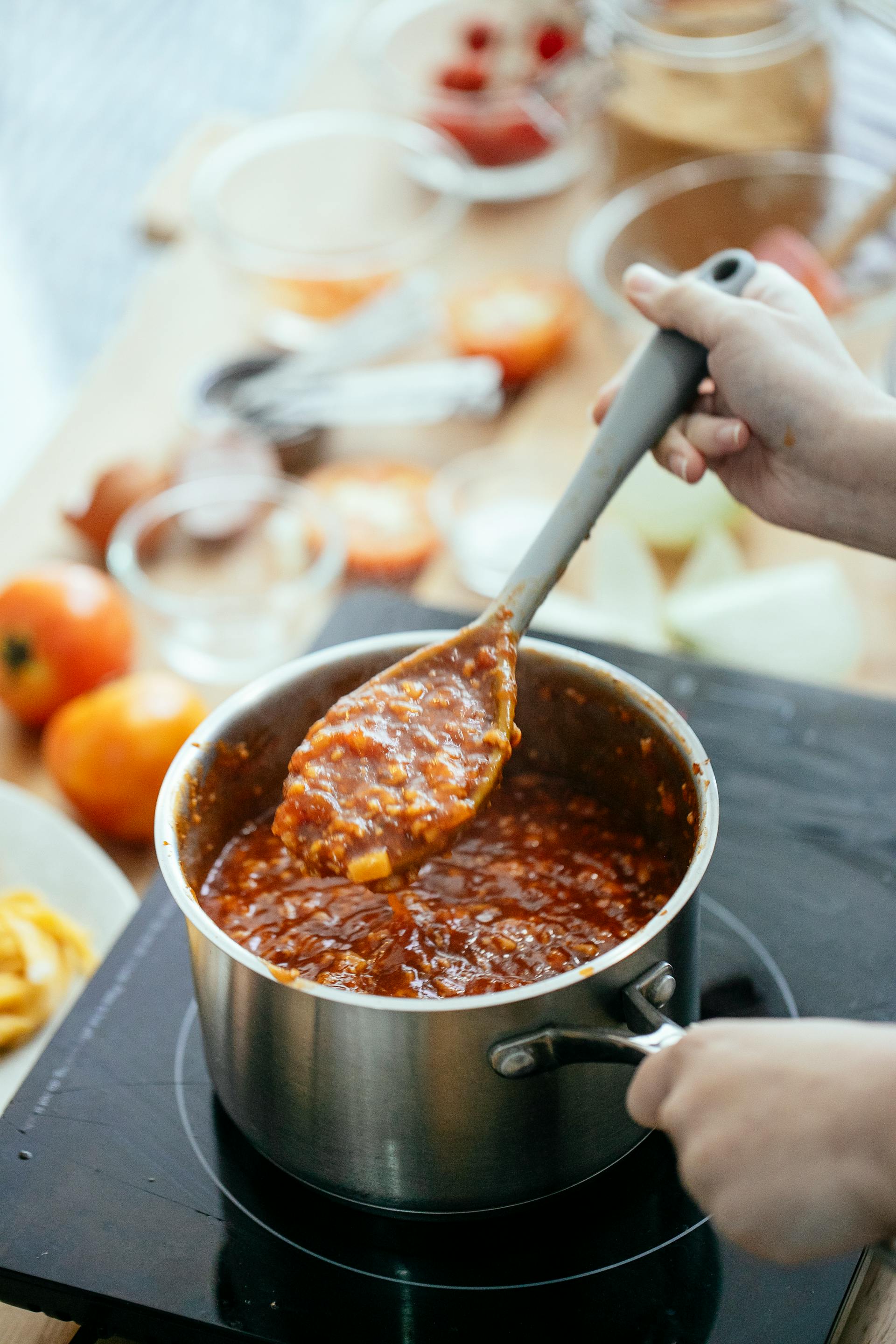 A person cooking food in the kitchen | Source: Pexels
