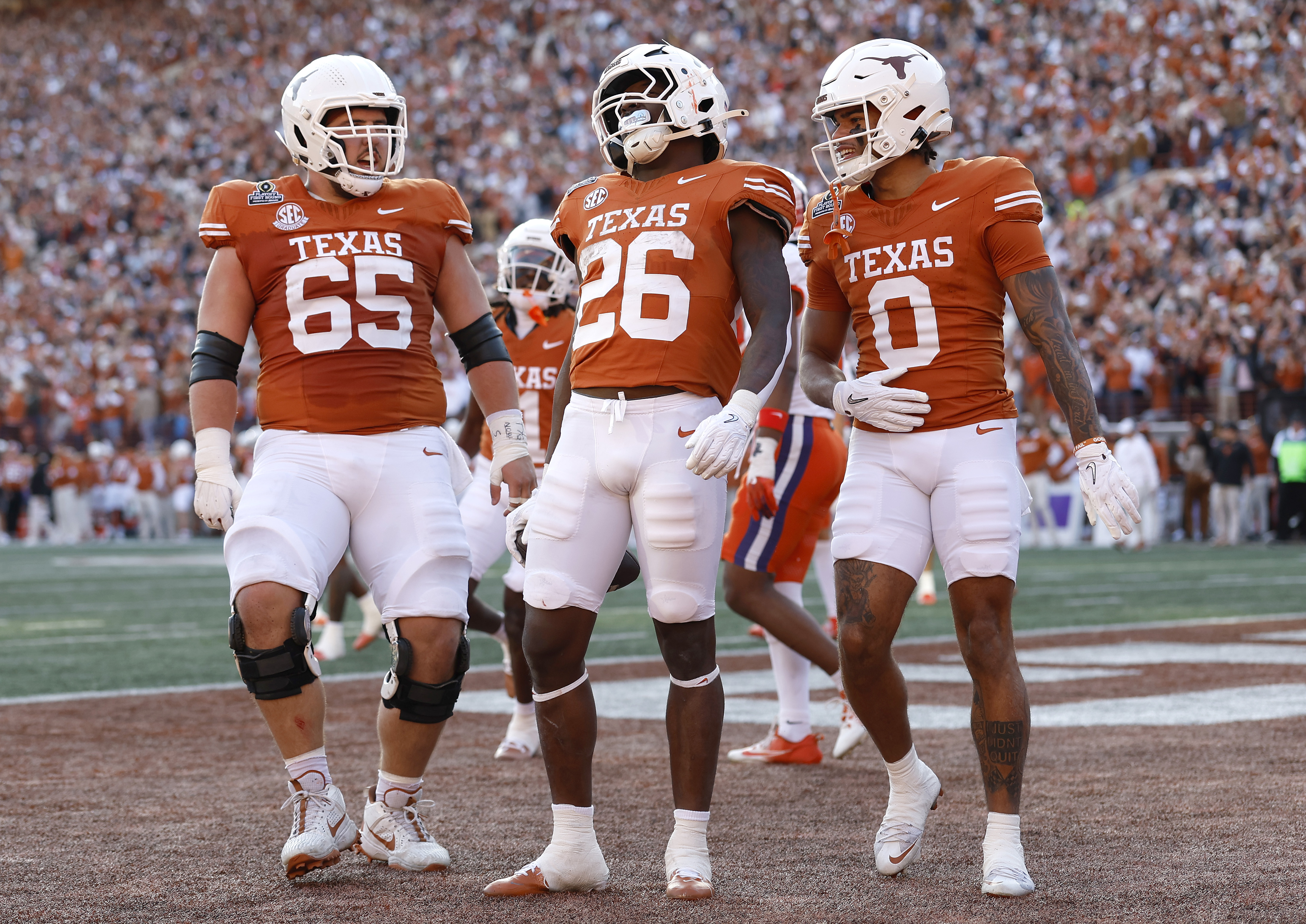 Quintrevion Wisner of the Texas Longhorns celebrates with teammates after running the ball for a touchdown during the second quarter against the Clemson Tigers in the Playoff First Round Game in Austin, Texas, on December 21, 2024 | Source: Getty Images