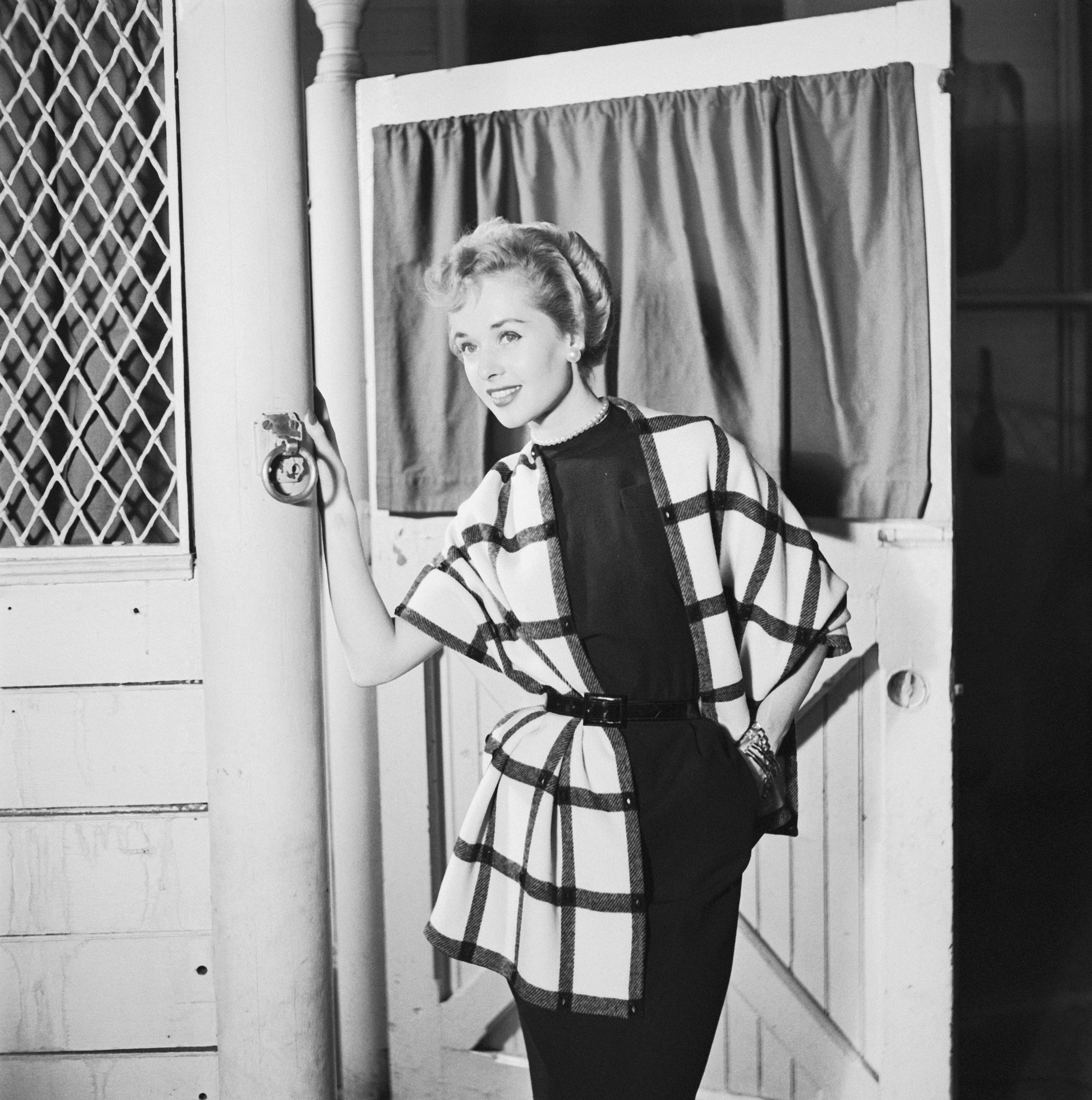 Tippi Hedren modeling an evening dress in 1954. | Source: Getty Images