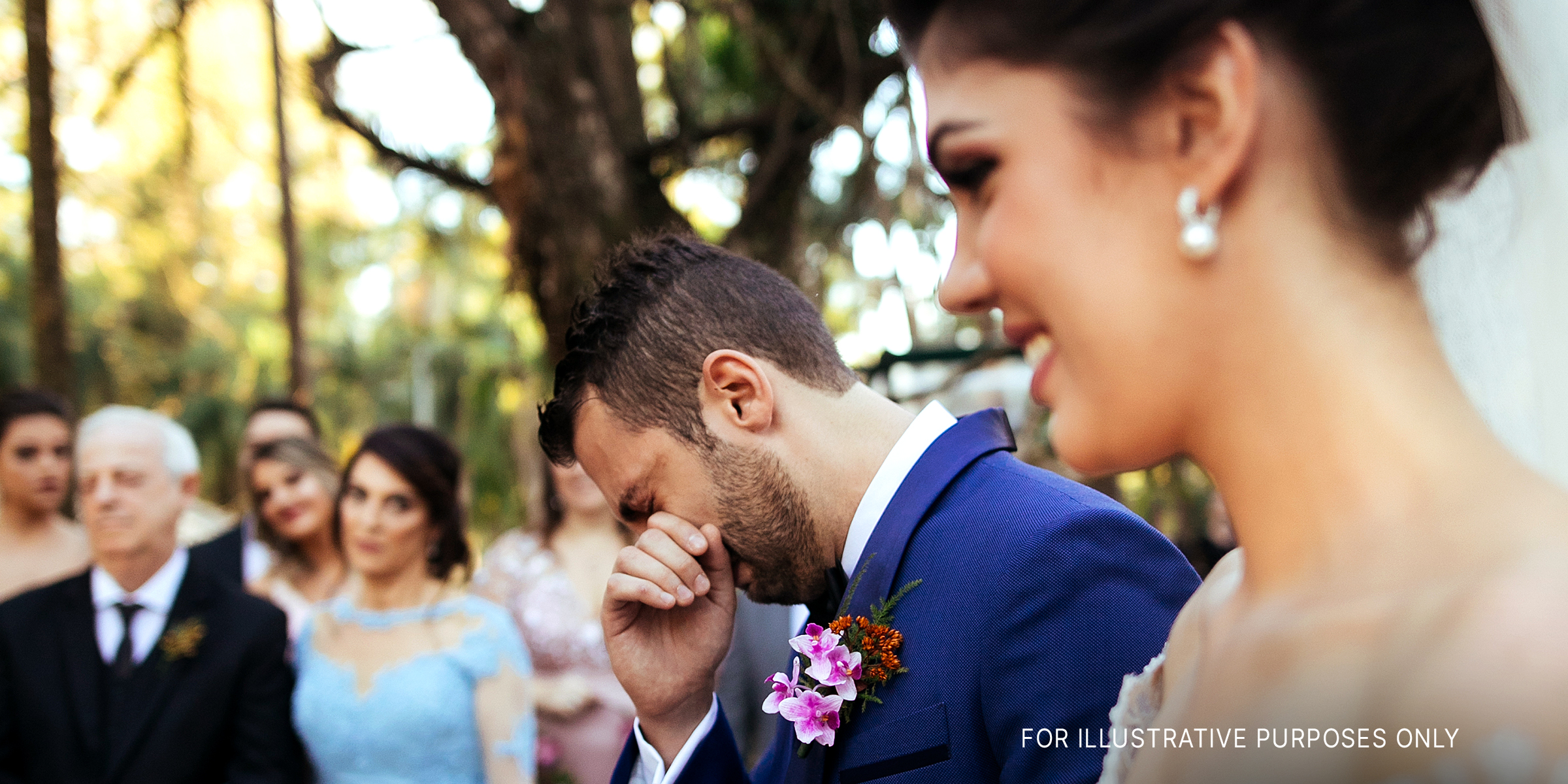 A groom crying next to his smiling bride | Source: Shutterstock