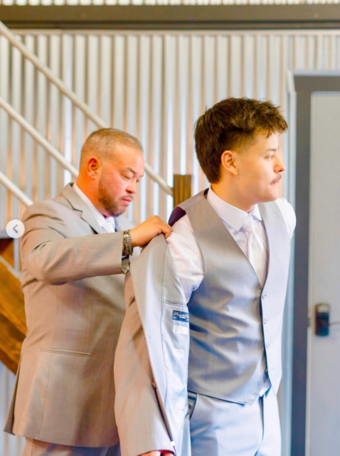 Collin served as a groomsman in his father's wedding. On this occasion, Jon was helping him with his jacket, posted on June 21, 2026. | Source: Instagram/collingosselin1
