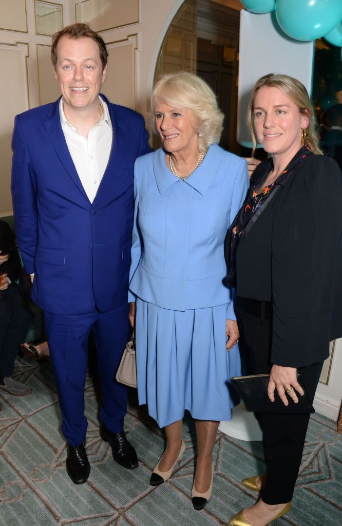 Tom Parker Bowles, Duchess Camilla, and Laura Lopes at the launch of the "Fortnum & Mason Christmas & Other Winter Feasts" cookbook on October 17, 2018, in London, England. | Source: David M. Benett/Dave Benett/Getty Images