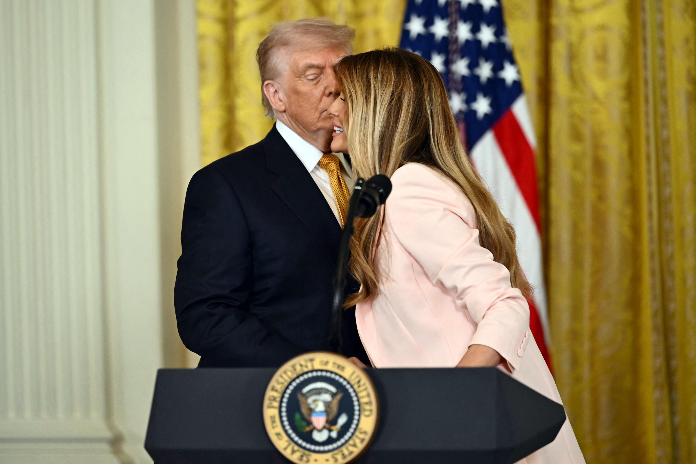 Donald and Melania Trump participate in a Military Mother's Day Event in the East Room of the White House in Washington, DC, on May 6, 2026 | Source: Getty Images