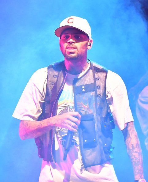 Chris Brown performing onstage during his "IndiGOAT" tour in Atlanta, Georgia. | Photo: Getty Images