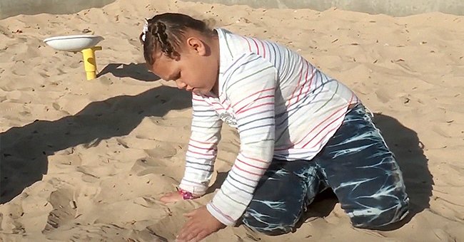 A picture of Kaitlyn playing by herself at a playground| Photo:   youtube.com/KFOR Oklahoma's News 4  