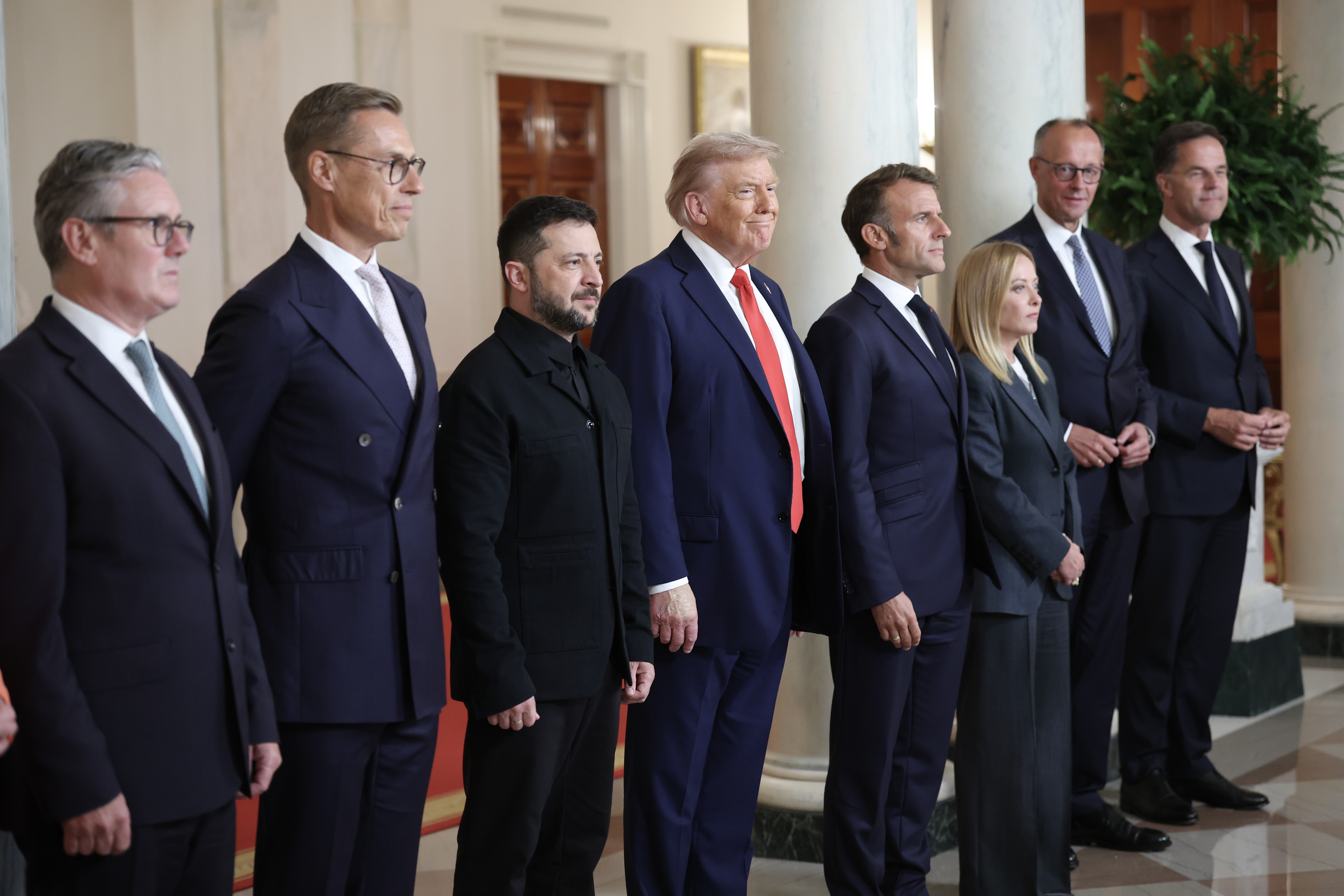 President Donald Trump and President Volodymyr Zelensky pose for a picture with European leaders following a meeting in the Oval Office in Washington, DC on August 18, 2025 | Source: Getty Images