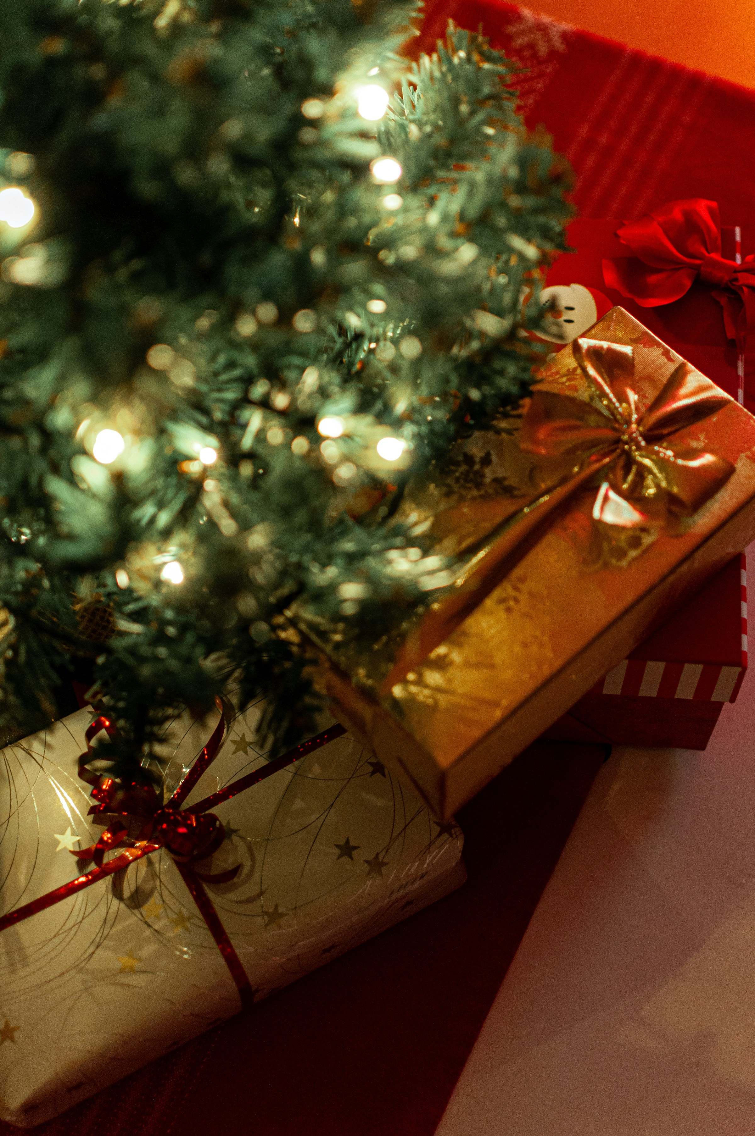 Presents under a Christmas tree | Source: Unsplash