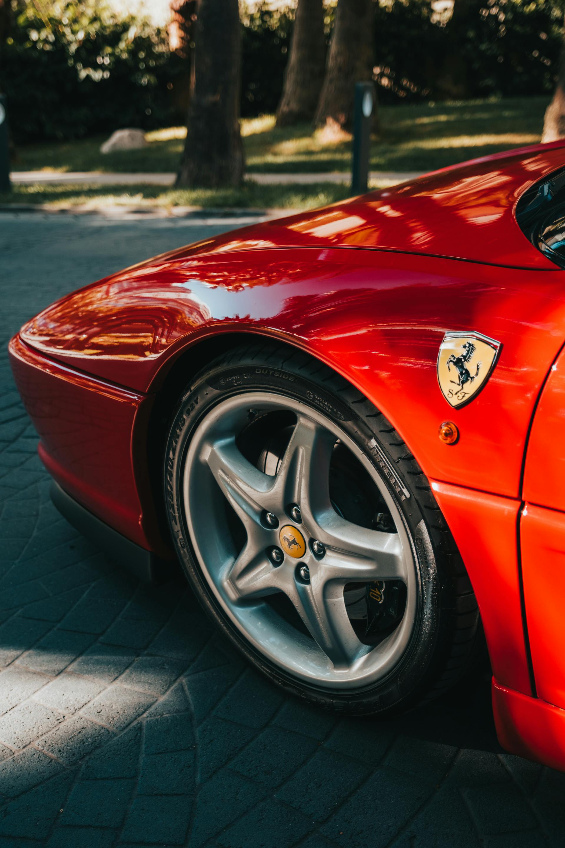 A close-up of a red Ferrari on the street | Source: Pexels