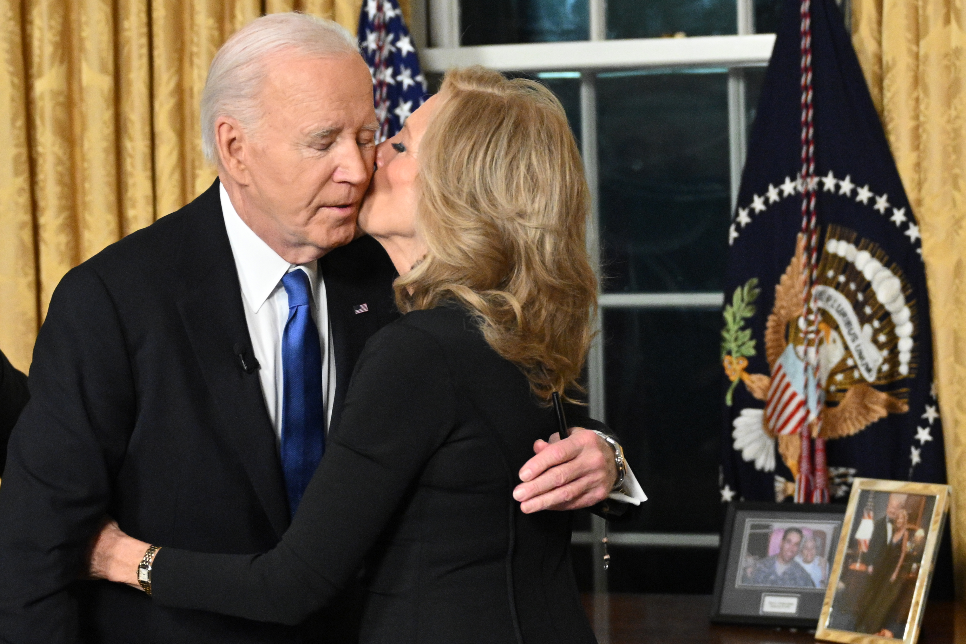 Jill Biden kisses Joe Biden after he delivered his farewell address to the nation from the Oval Office of the White House on January 15, 2025 in Washington, DC | Source: Getty Images