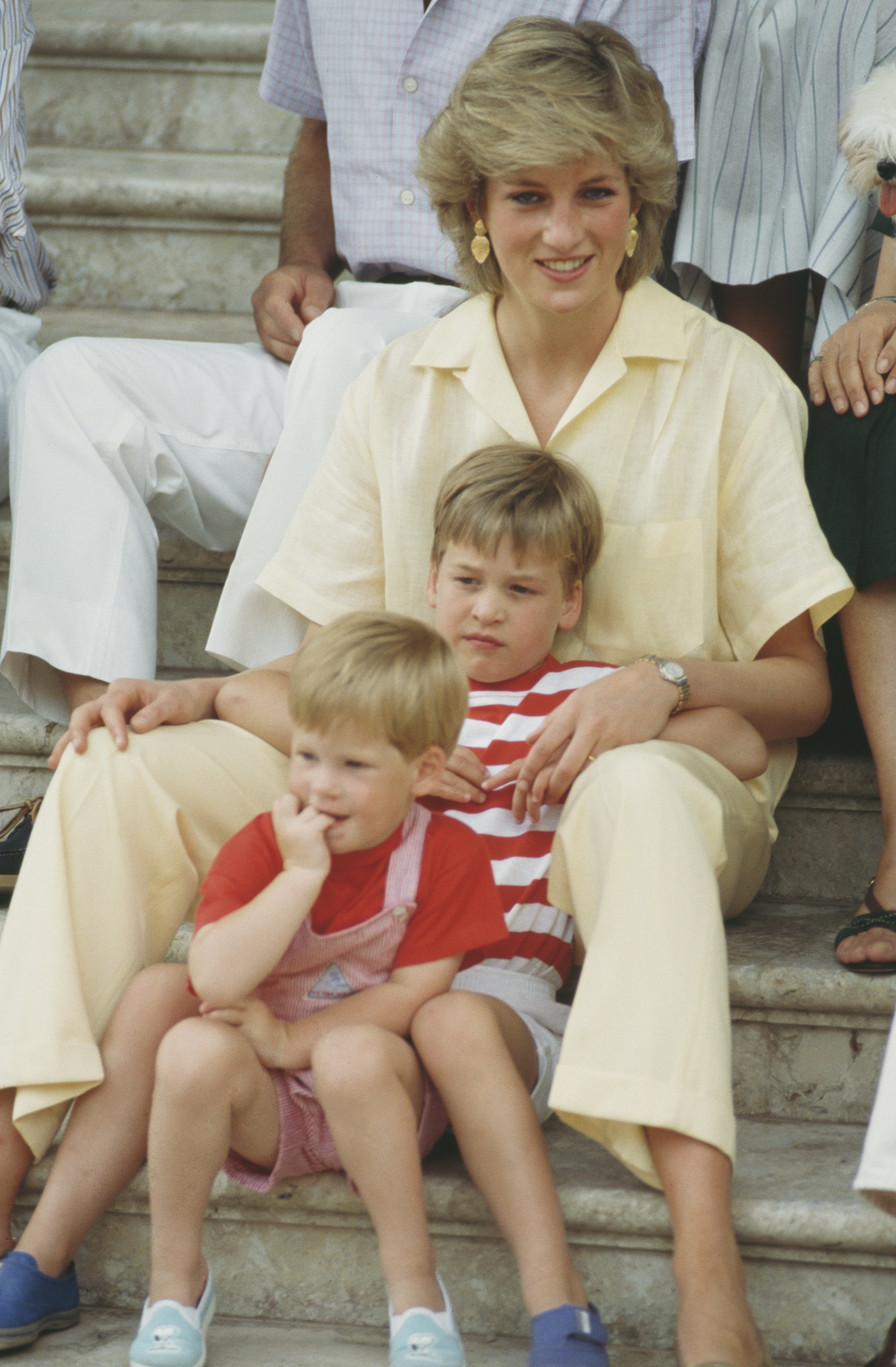 Princess Diana with her sons Princes William and Harry during a holiday with the Spanish royal family in Palma de Mallorca, Spain, in August 1987. | Source: Terry Fincher/Princess Diana Archive/Getty Images