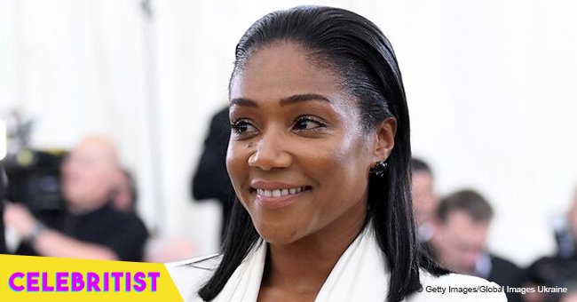 Tiffany Haddish stuns in sequined, red maxi-dress, posing with Kevin Hart in recent photo