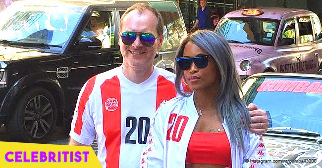 Eve flaunts curves in long pink dress in picture with her husband