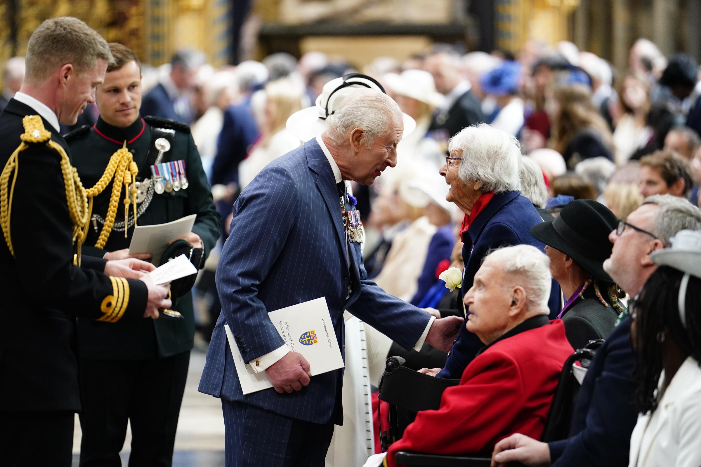 King Charles III speaks to a veteran at the end of the Service of Thanksgiving at Westminster Abbey in London on the 80th anniversary of VE Day in London, England, on May 8, 2025 | Source: Getty Images